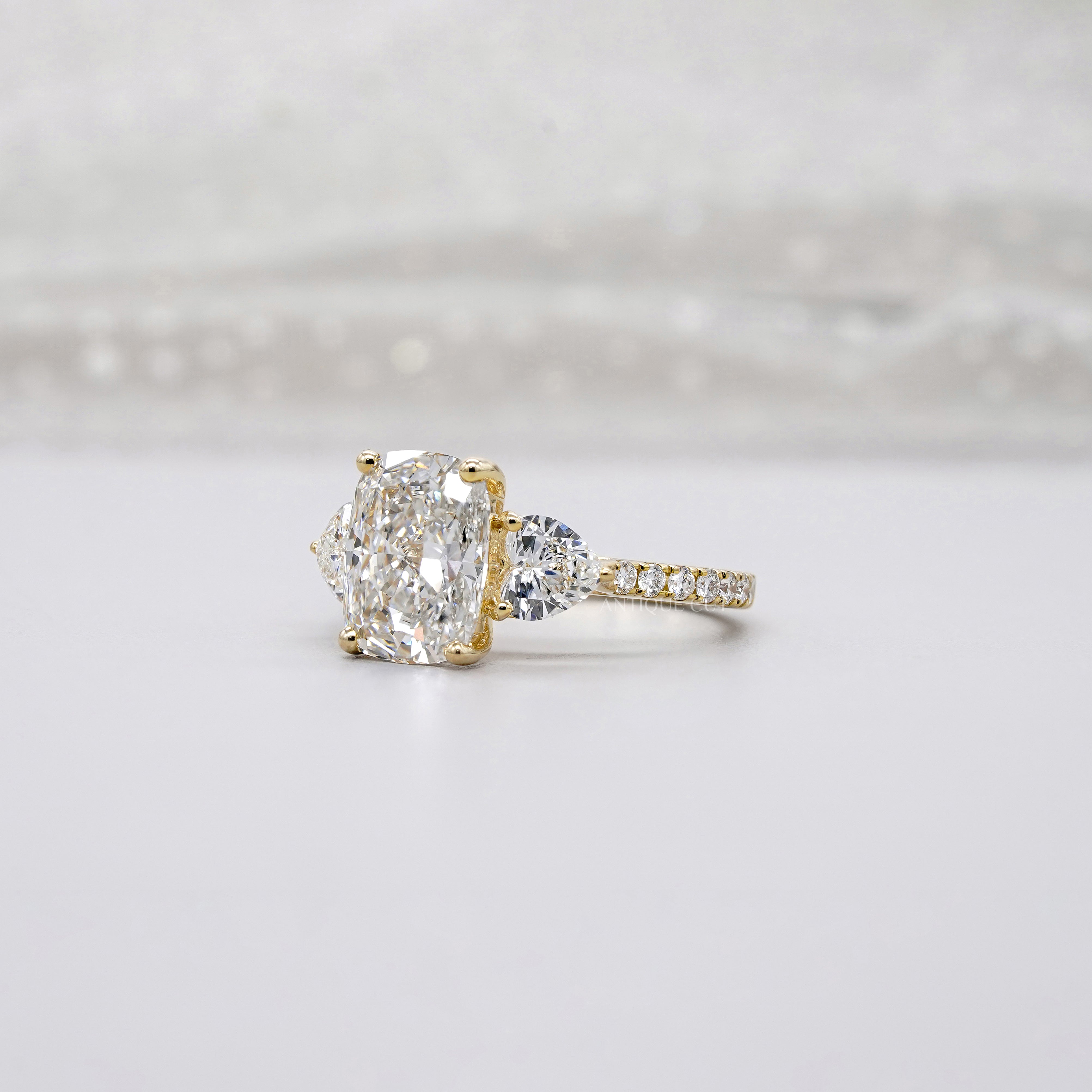 Cushion 3.90tcw Lab-Grown Diamond Three-Stone Ring | Heart & Round Side Stones | Yellow Gold