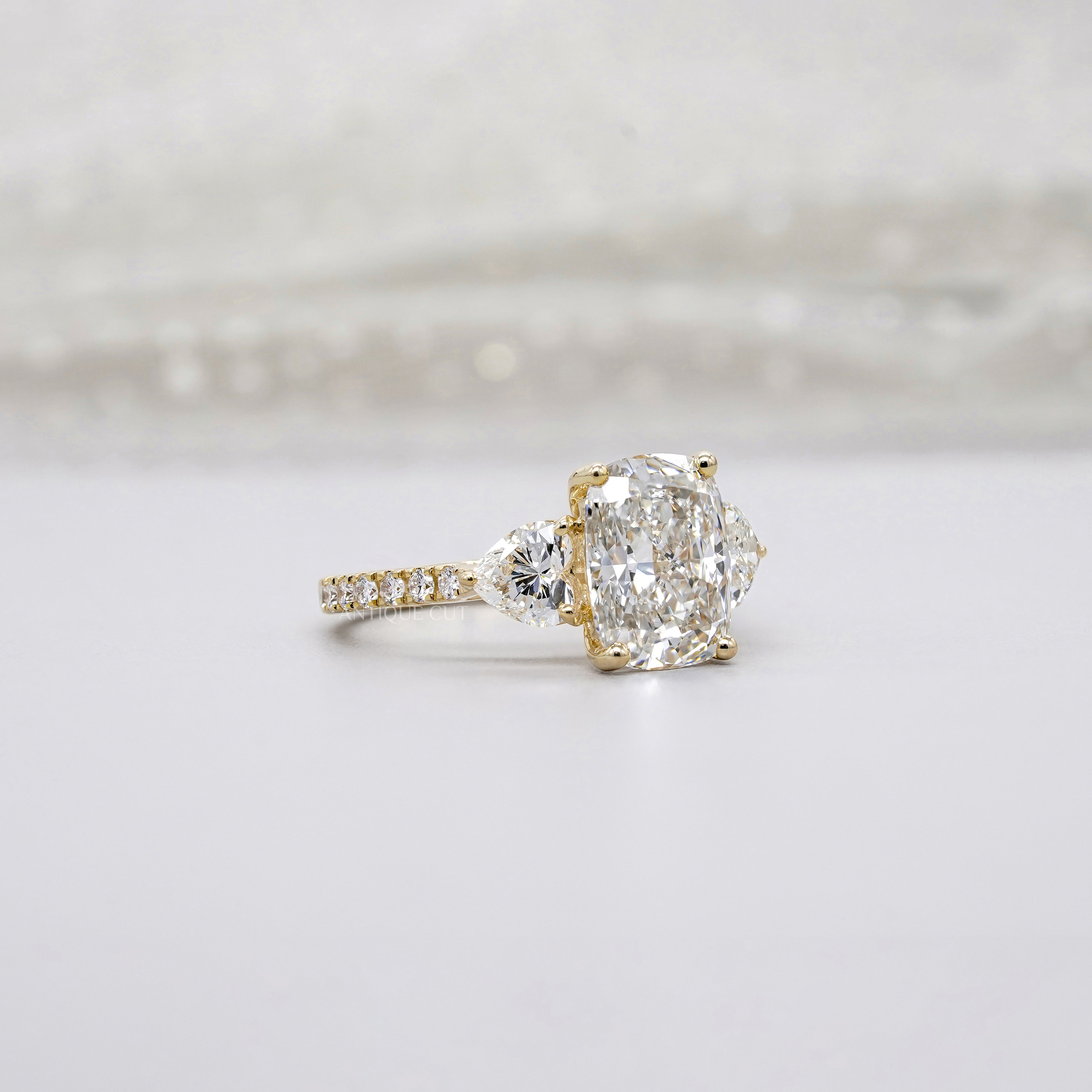 Cushion 3.90tcw Lab-Grown Diamond Three-Stone Ring | Heart & Round Side Stones | Yellow Gold