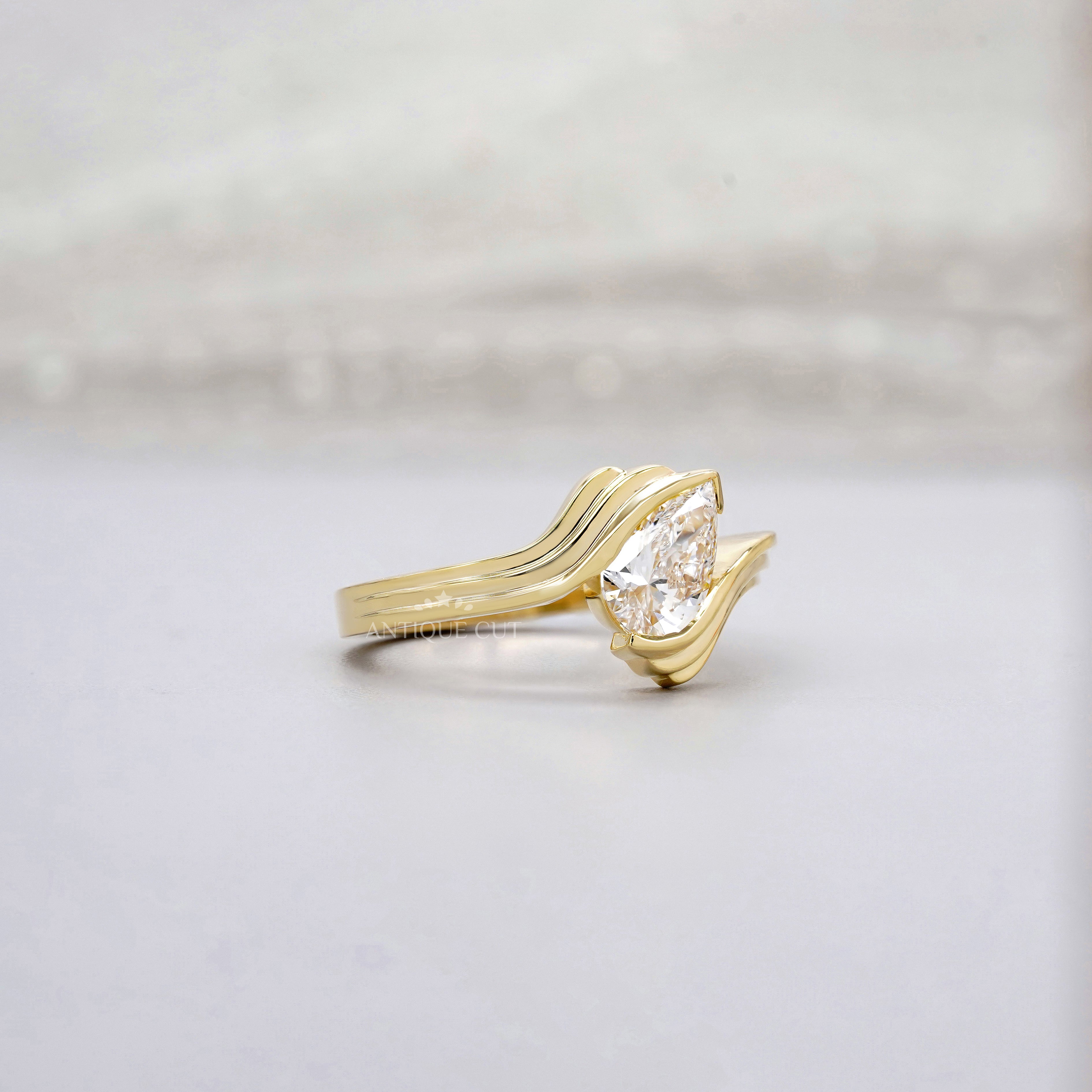 1.00ct Pear Lab Diamond Wave Solitaire Ring | Sculpted Yellow Gold | IGI Certified