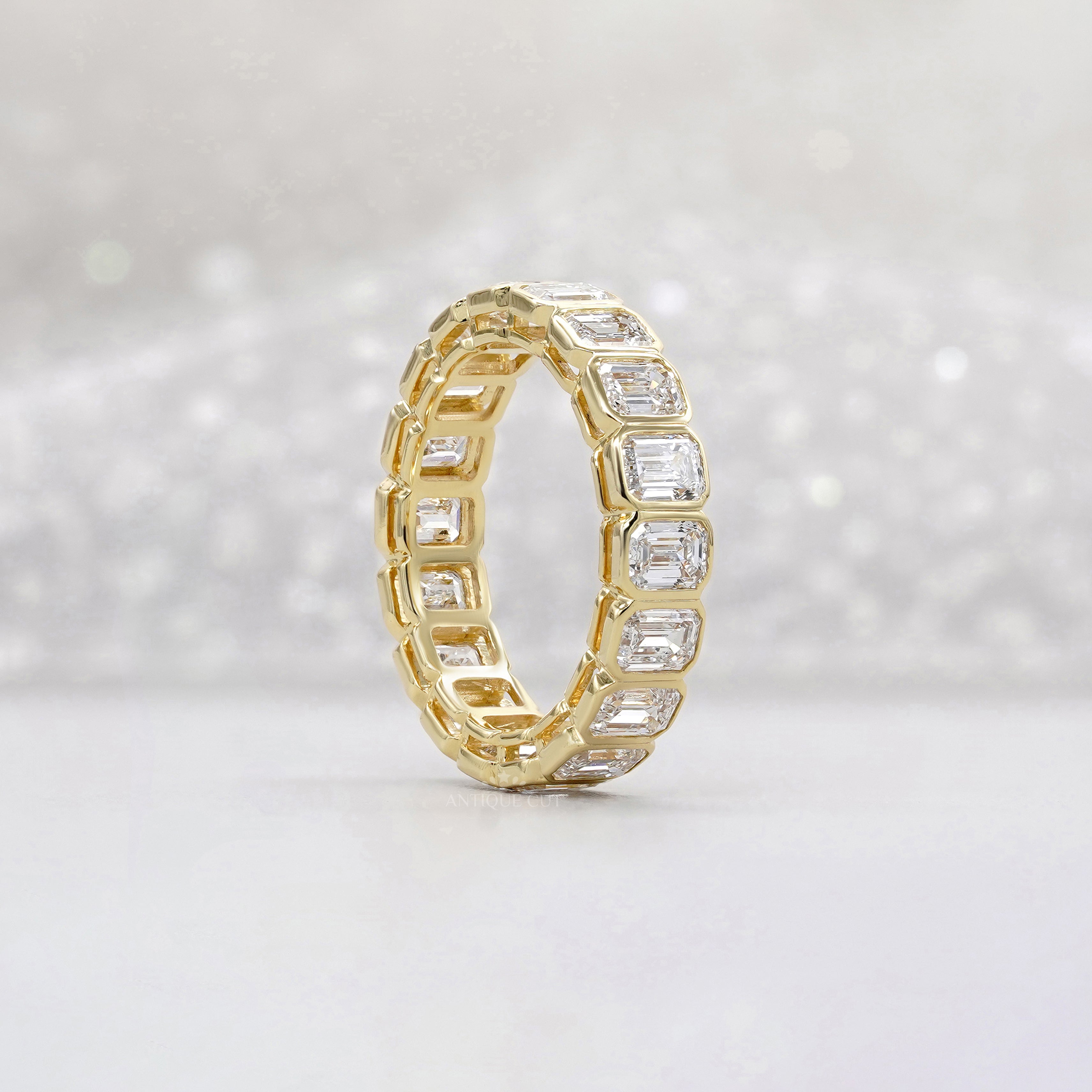 Emerald Cut 3.60tcw Lab Diamond Eternity Band | IGI Certified | Yellow Gold