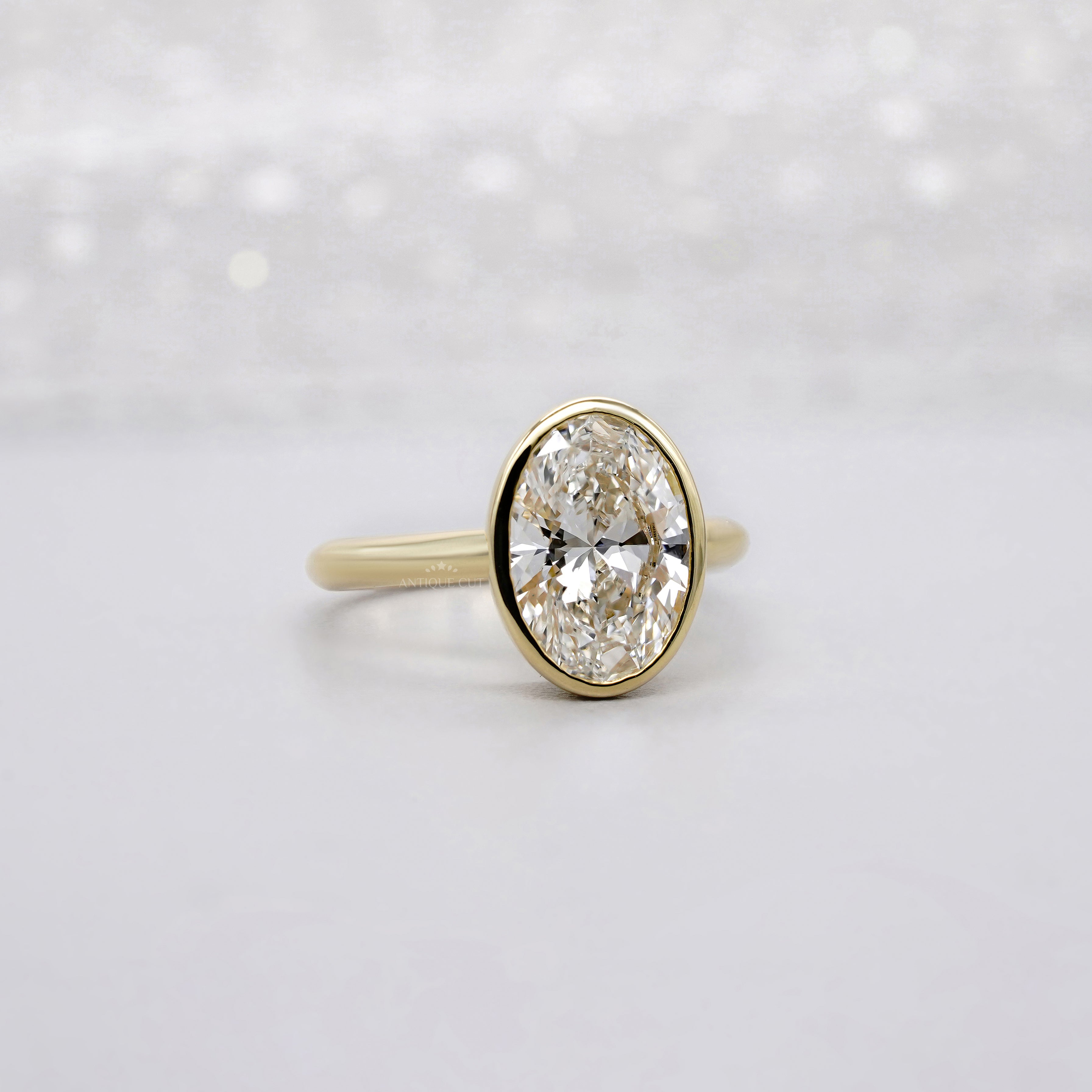 Oval 2.00ct Lab Grown Diamond Bezel Set Engagement Ring in Yellow Gold | IGI Certified