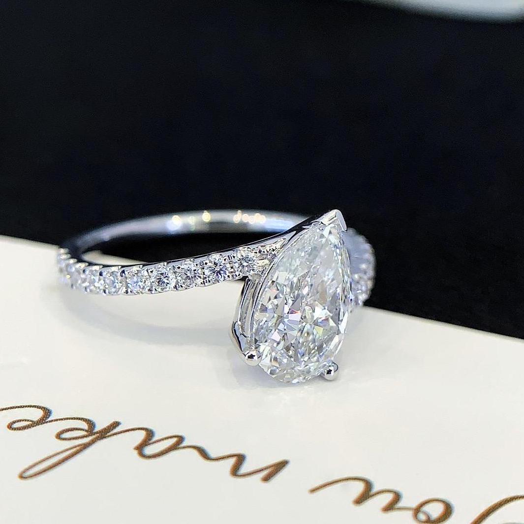 Pear 2.00tcw Lab Grown Diamond Solitaire Basket With Bypass Band Engagement Ring, D-E-F Color, VVS-VS Clarity - IGI Certified
