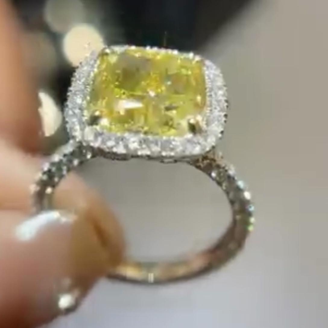 Fancy Yellow 5.00tcw Cushion Lab Diamond Halo Engagement Ring | 4ct Center | IGI Certified