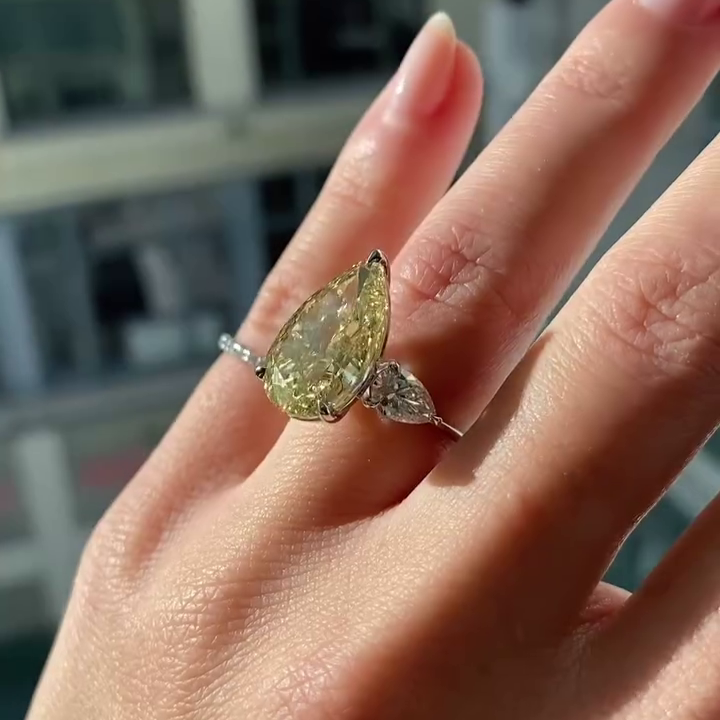 Pear Fancy Yellow 8.80tcw Lab Diamond Three Stone Ring | IGI VVS–VS
