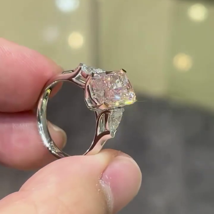 4.40tcw Fancy Pink Cushion Lab Grown Diamond Ring | 0.40ct Pear Side Stones | Three Stone Style Ring | White Gold | With IGI Certified