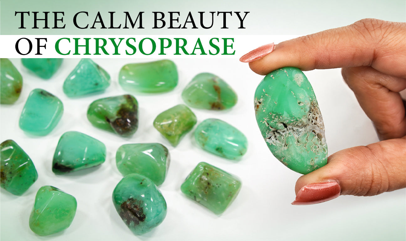 Hand holding a raw chrysoprase stone with smooth green surface and natural inclusions alongside polished chrysoprase pieces
