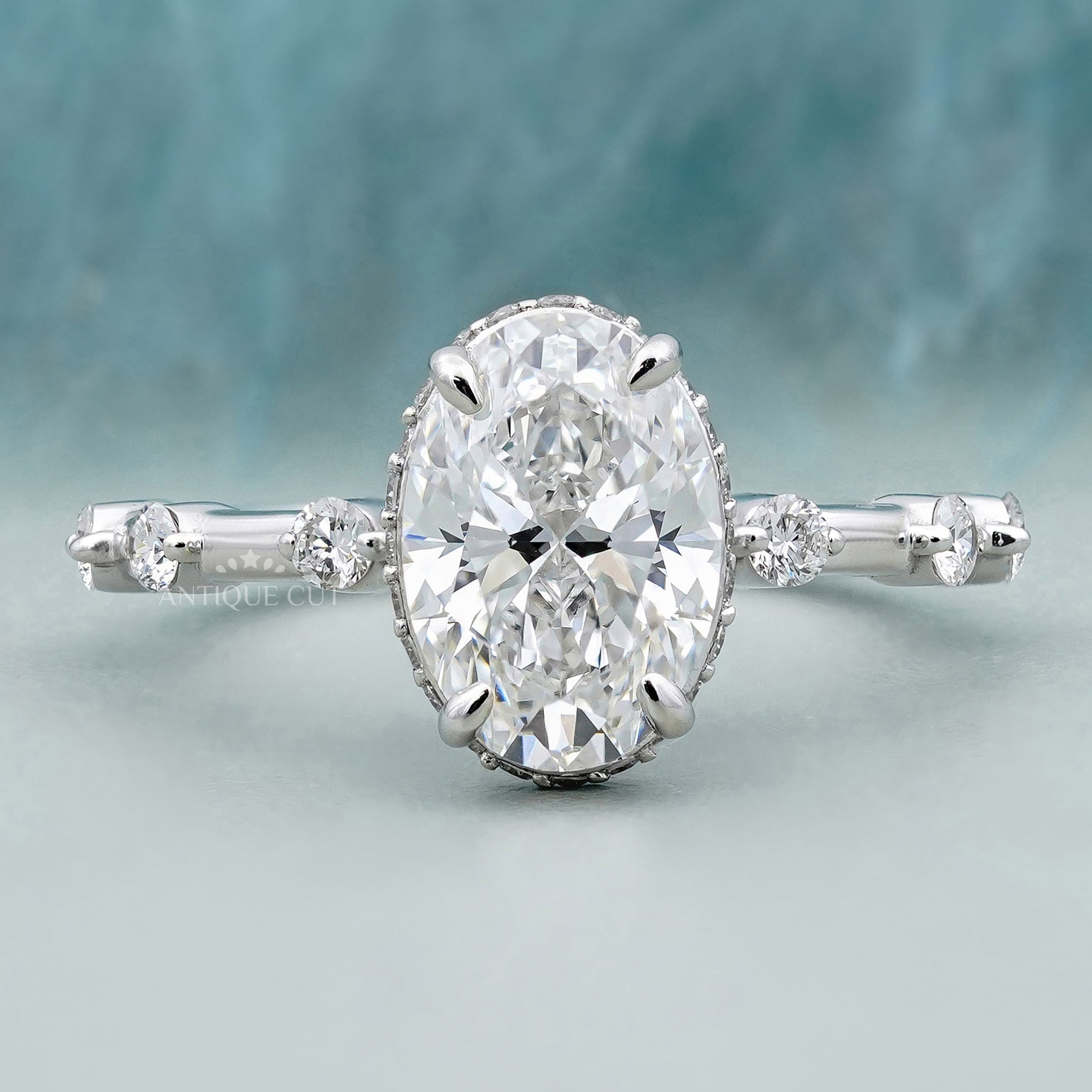 Oval cut engagement ring with accent band in white gold