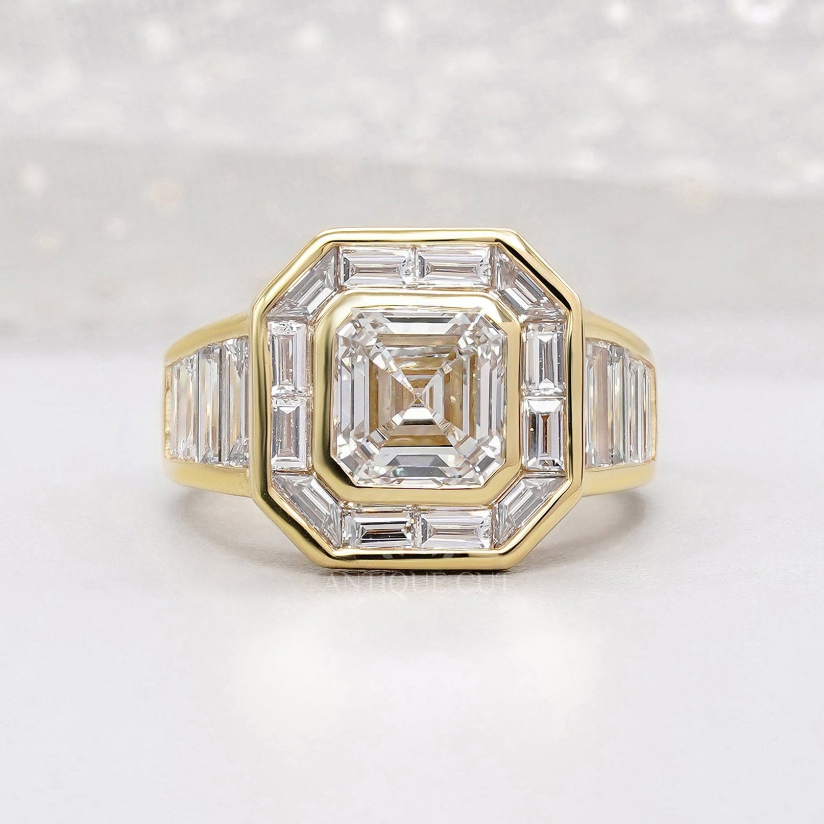 Halo Asscher cut engagement ring in yellow gold