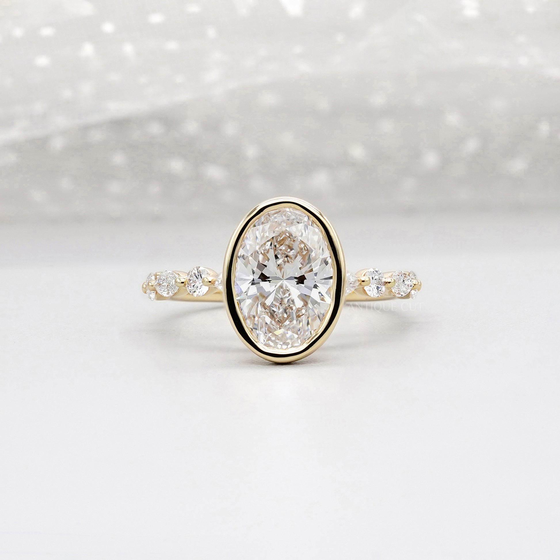 Oval 3.50tcw Bezel Set Lab Grown Diamond Engagement Ring | Yellow Gold with Side Stones | IGI Certified