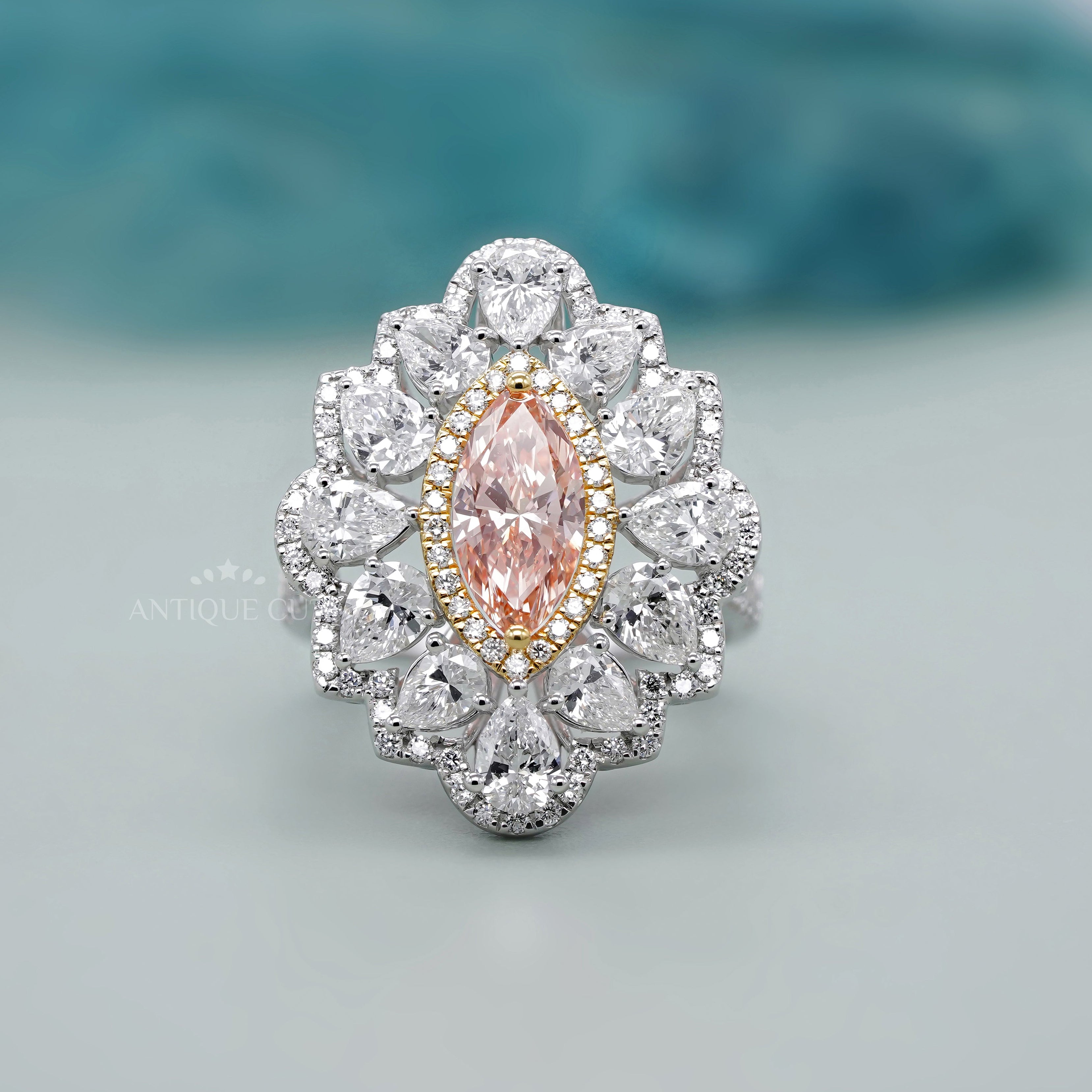 Fancy pink diamond ring marquise cluster halo white gold