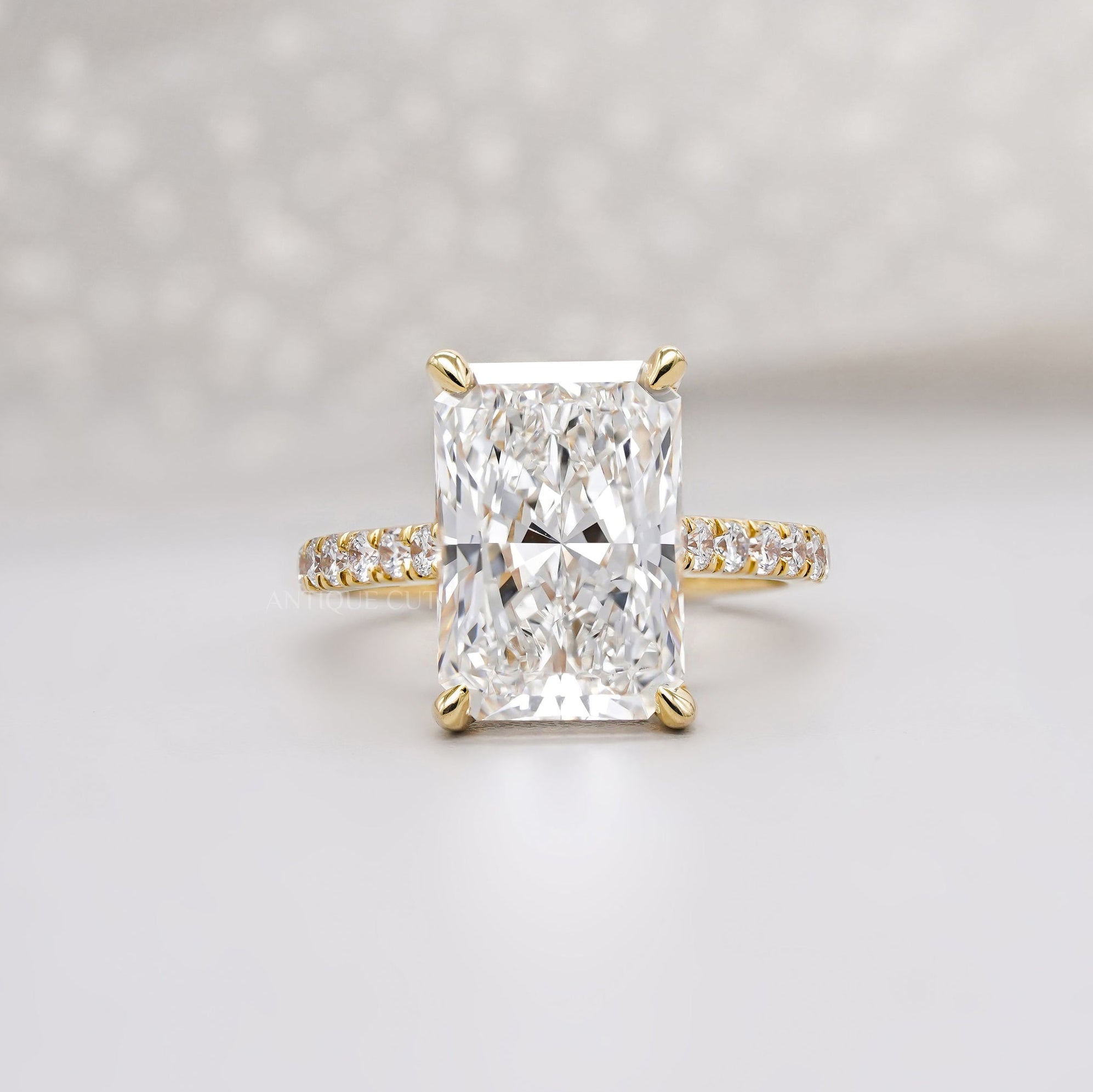 Radiant cut engagement ring in yellow gold