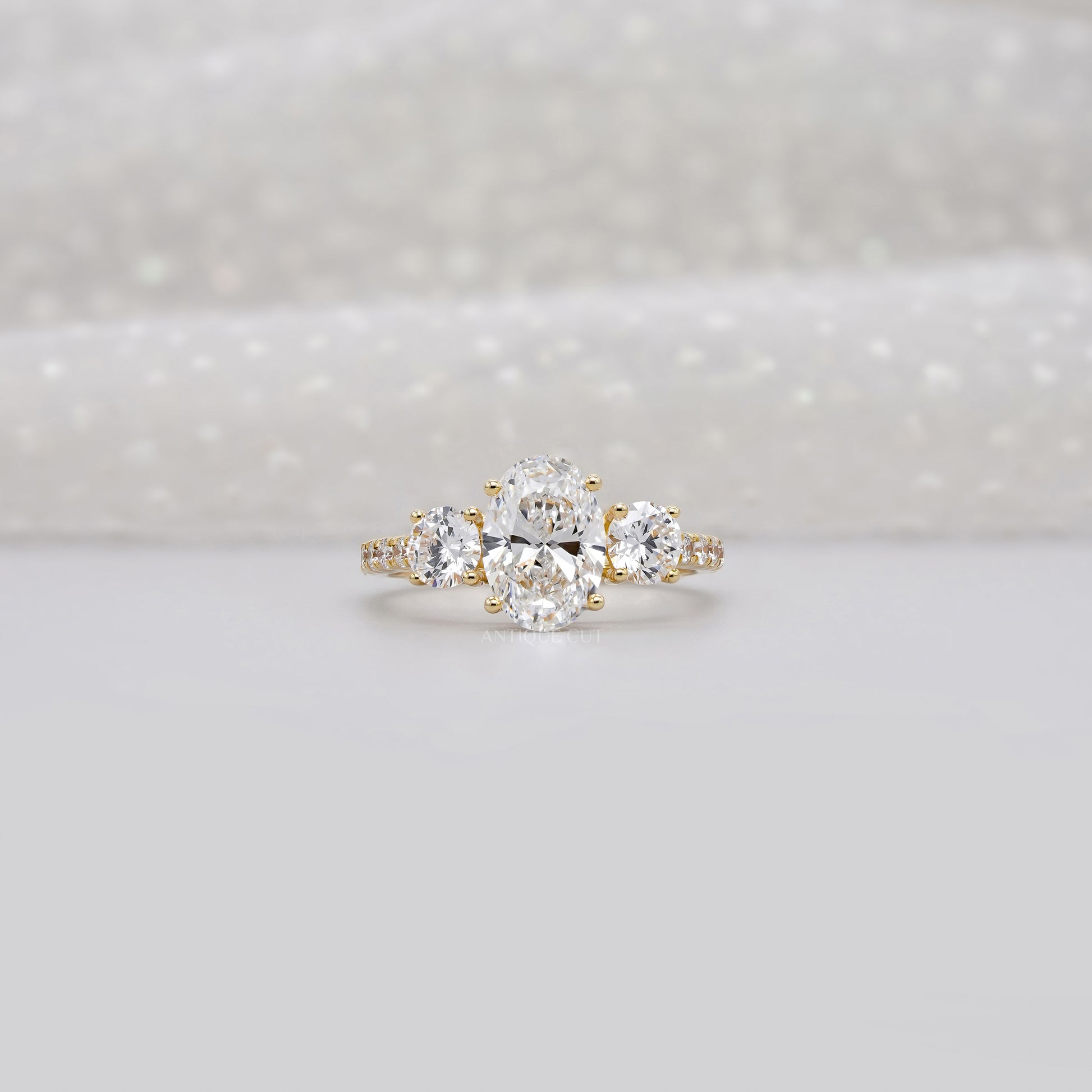 2.40tcw Oval & Round Lab-Grown Diamond Ring | Three-Stone Trellis Setting | IGI Certified