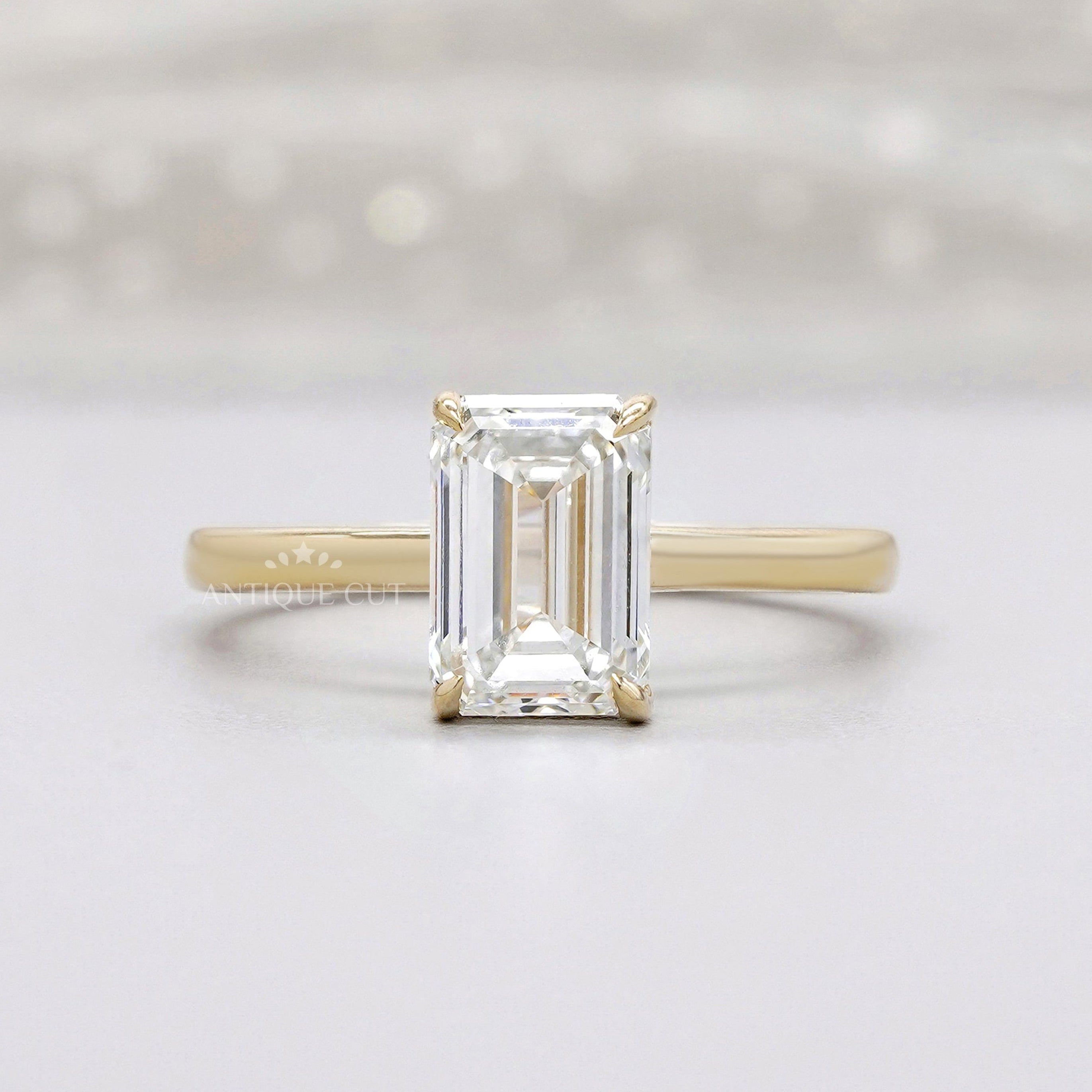 Emerald cut solitaire lab diamond engagement ring