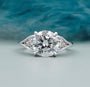 Round cut diamond engagement ring with side stones in white gold