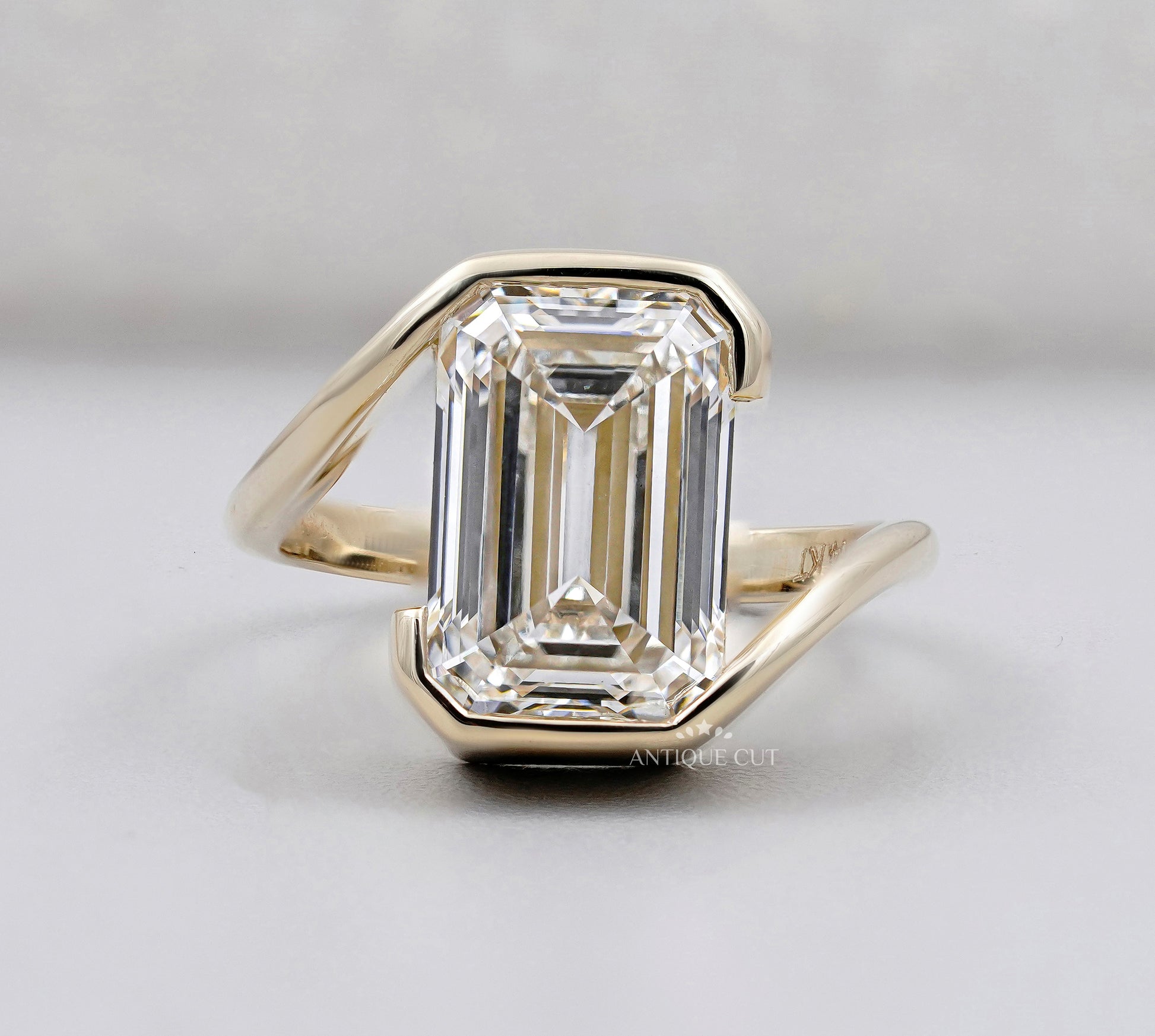 Emerald Cut Engagement Ring with Half Bezel Set