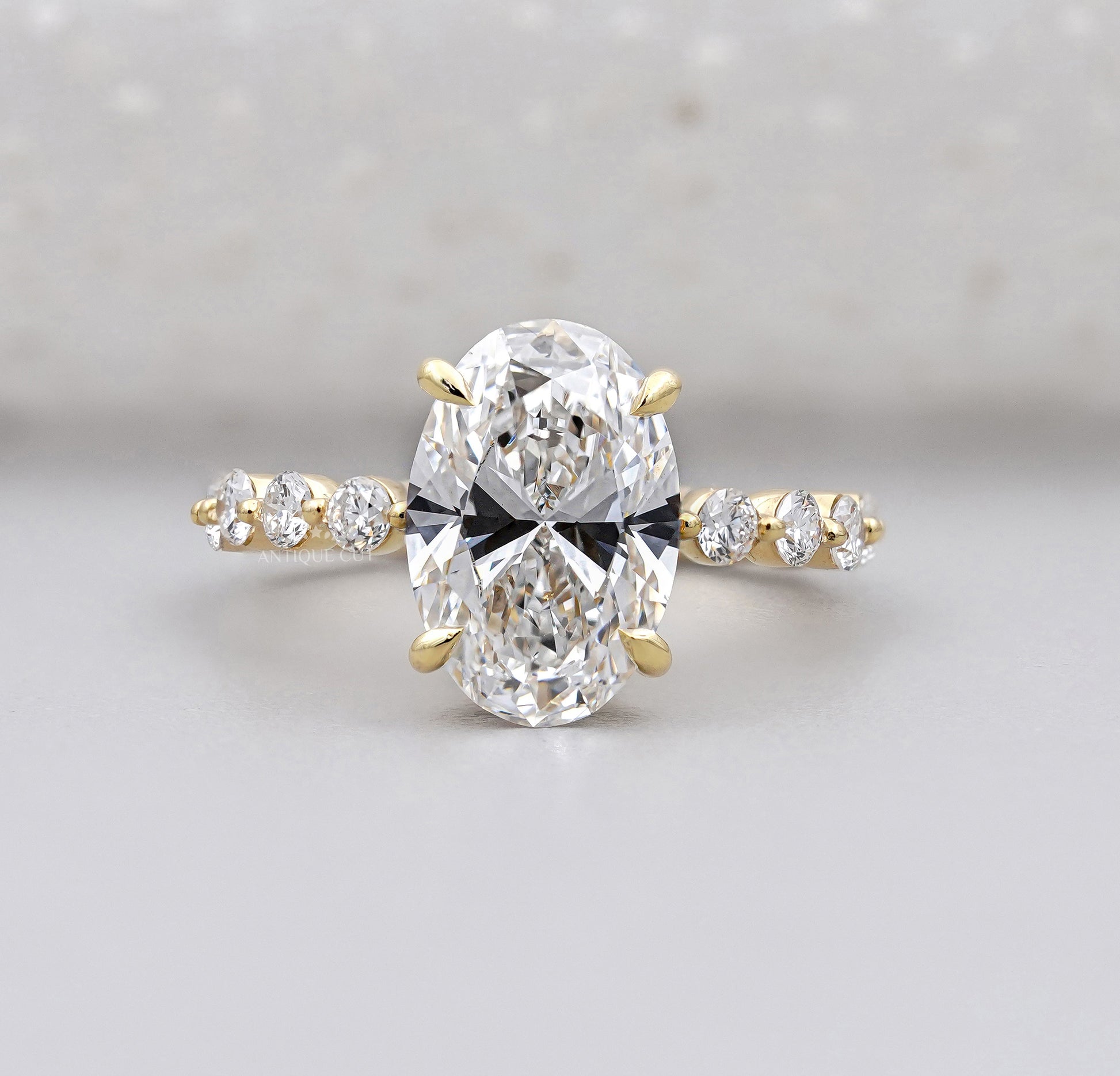 Hidden halo oval engagement ring with IGI-certified lab grown diamond