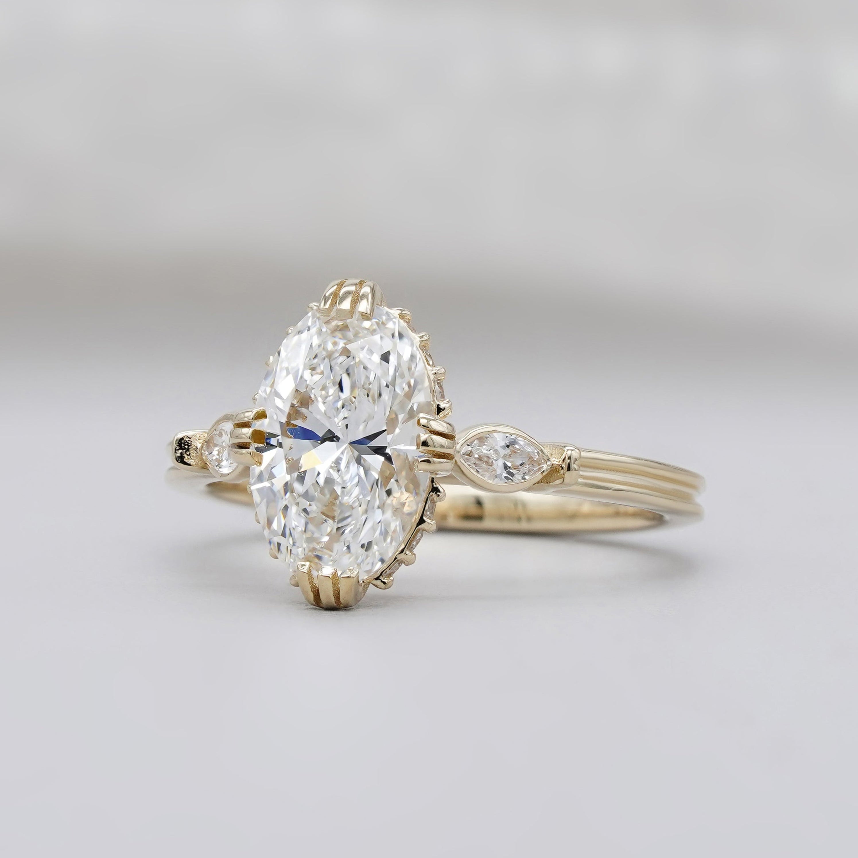 Three stone diamond ring with hidden halo