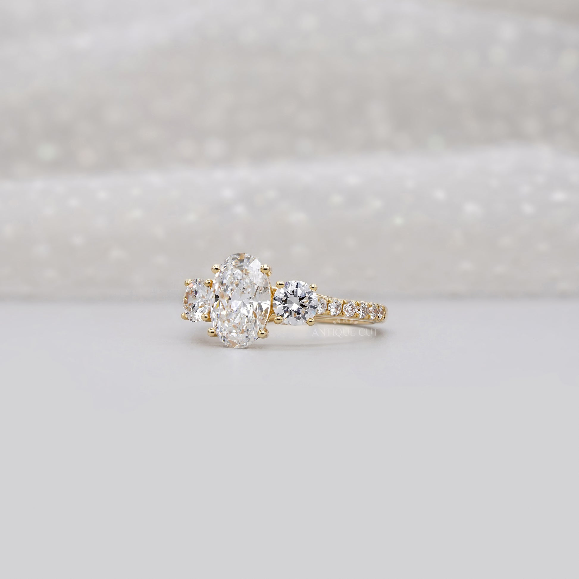 2.40tcw Oval & Round Lab-Grown Diamond Ring | Three-Stone Trellis Setting | IGI Certified