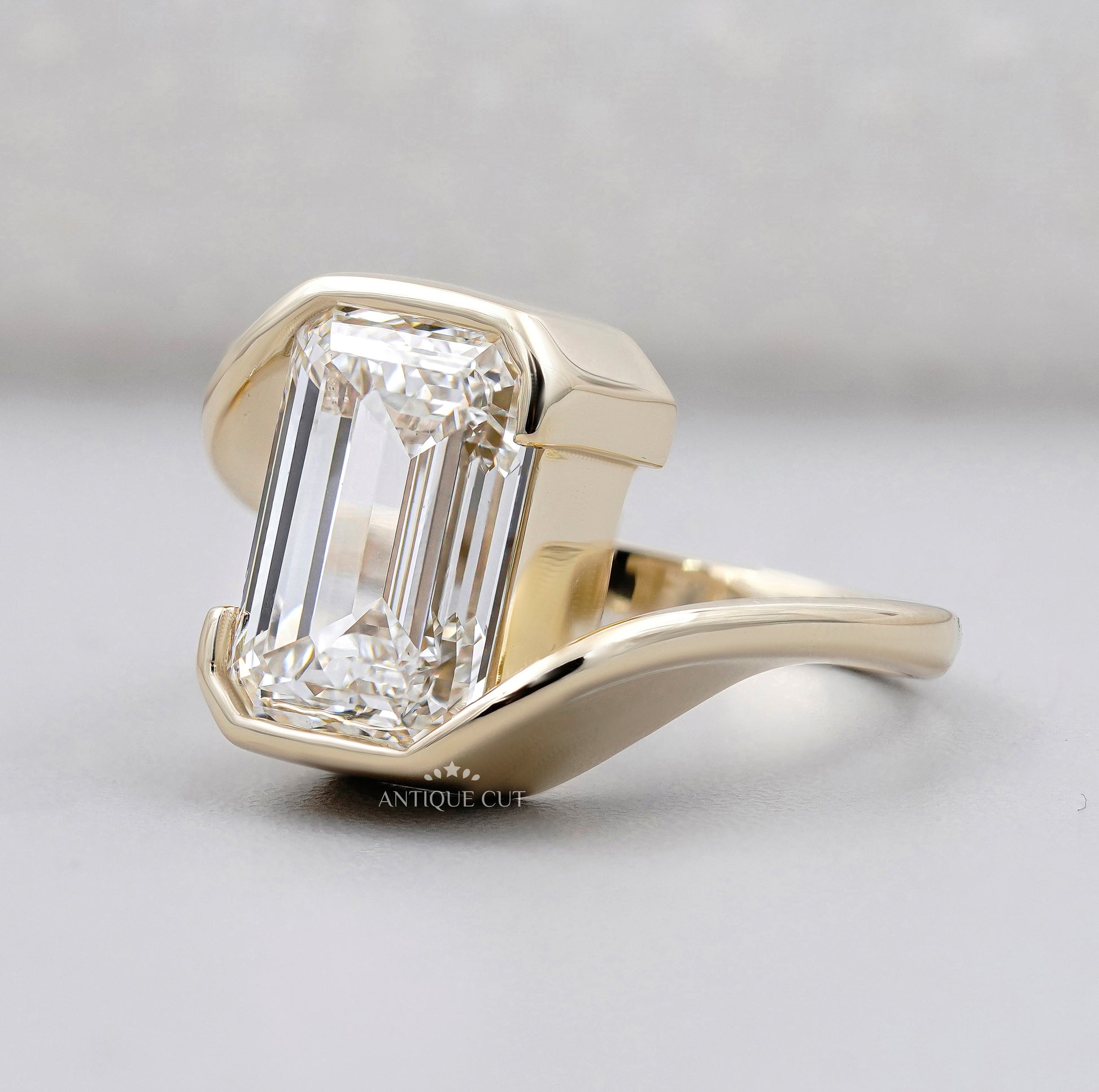 Emerald Cut Engagement Ring with Half Bezel Set