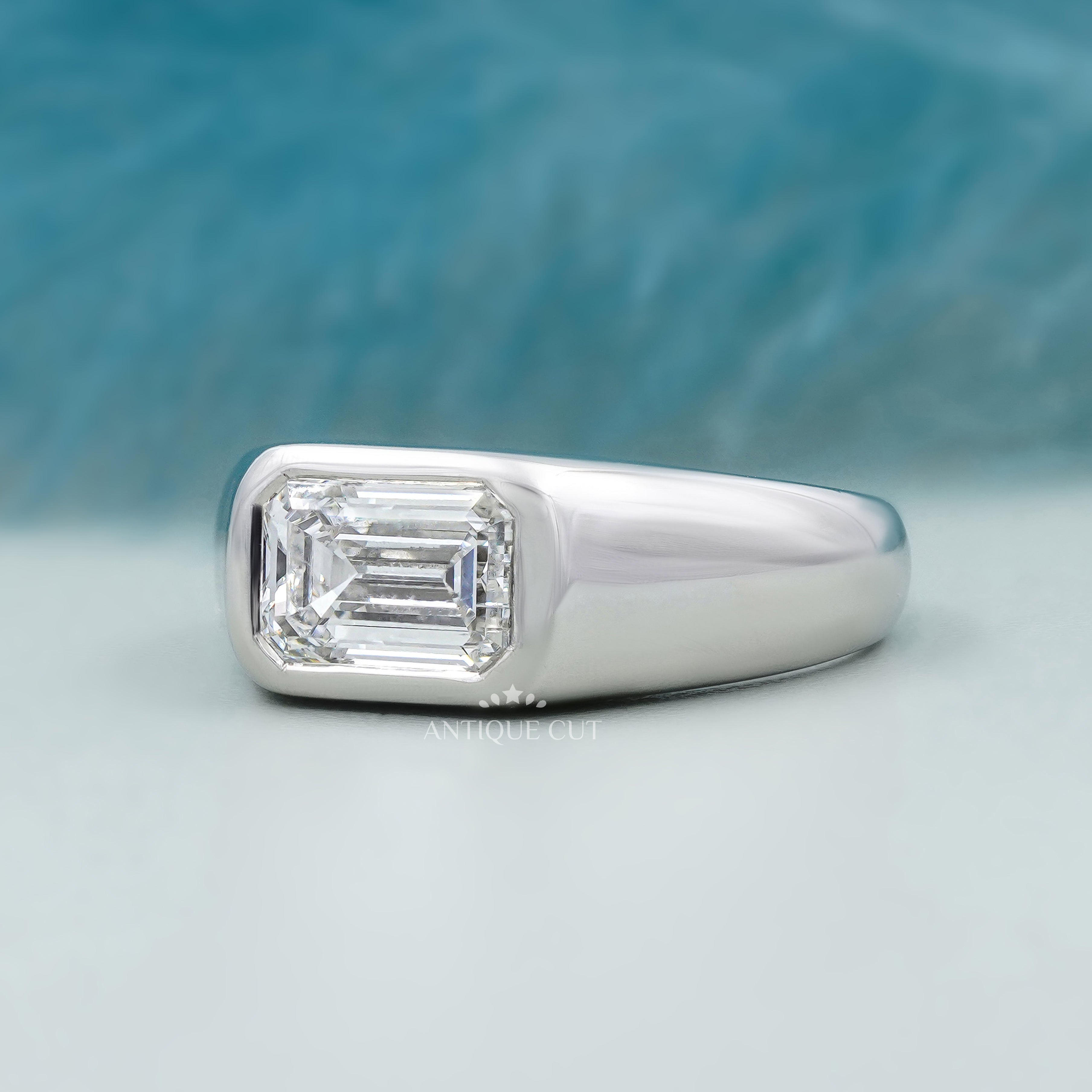 Emerald cut lab grown diamond ring with horizontal setting
