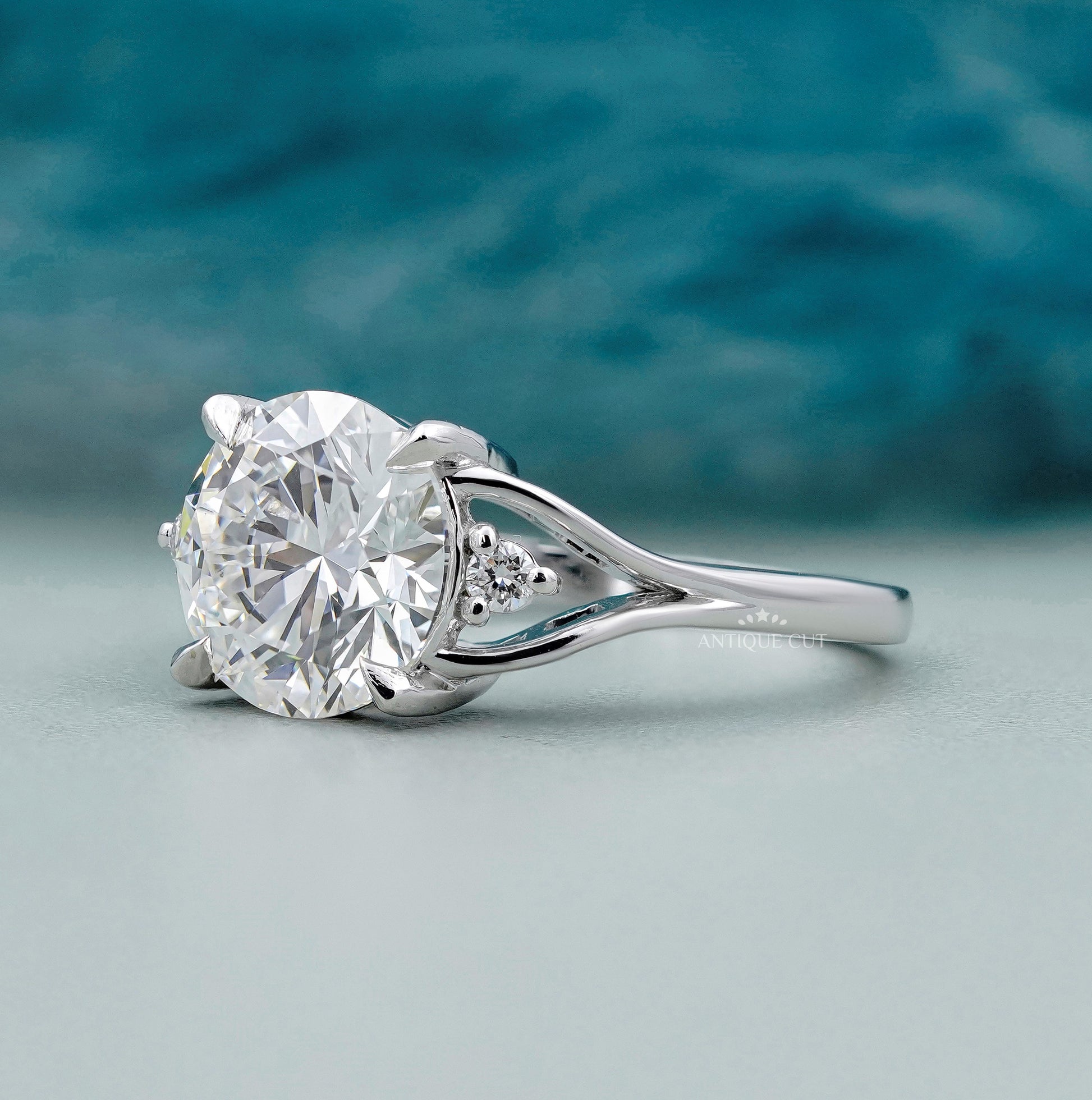 White gold round diamond ring with side diamond accents