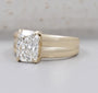 Rectangular radiant cut diamond engagement ring set in polished yellow gold