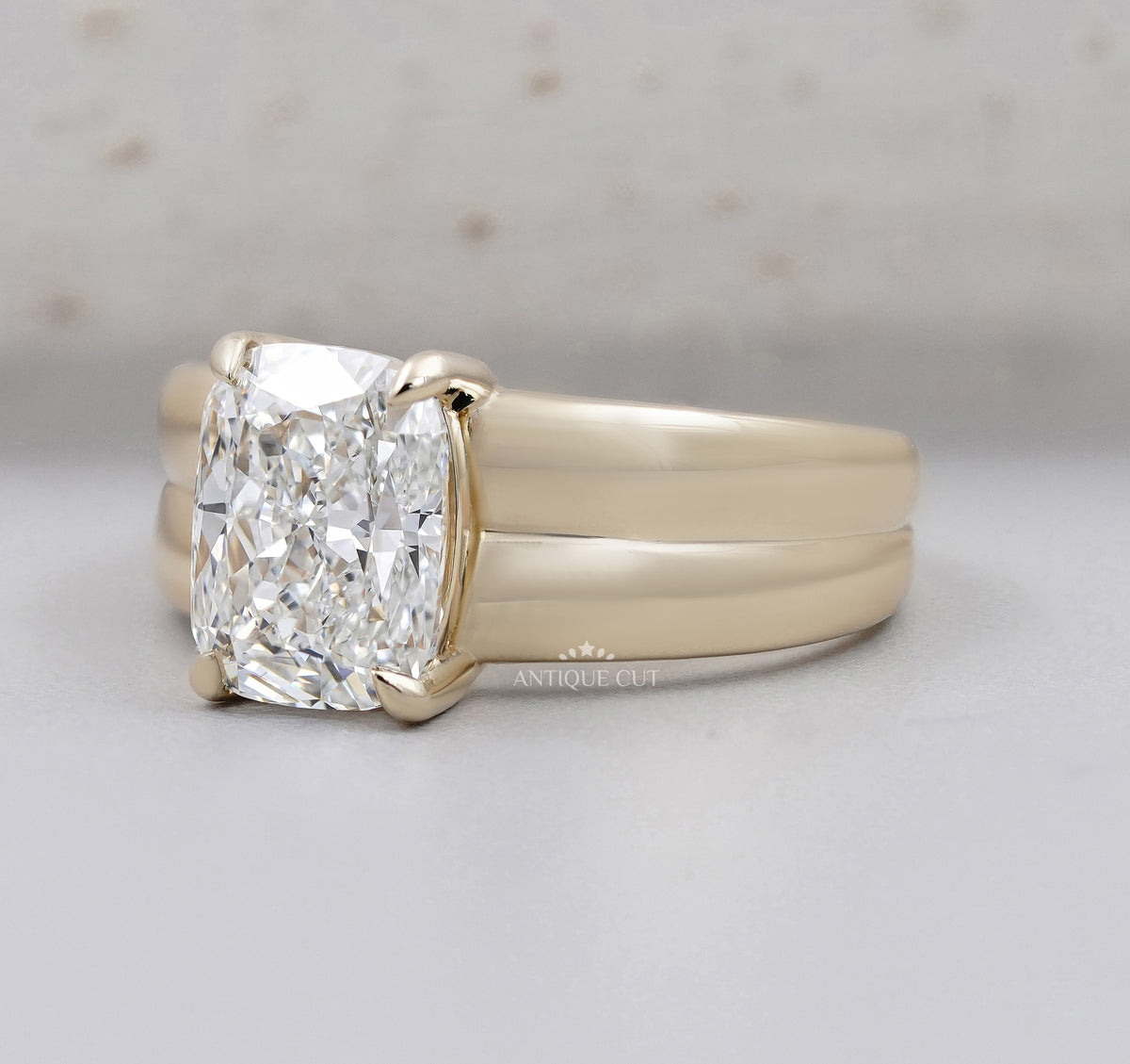 Rectangular radiant cut diamond engagement ring set in polished yellow gold