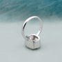 Lab grown elongated cushion solitaire ring with bezel setting