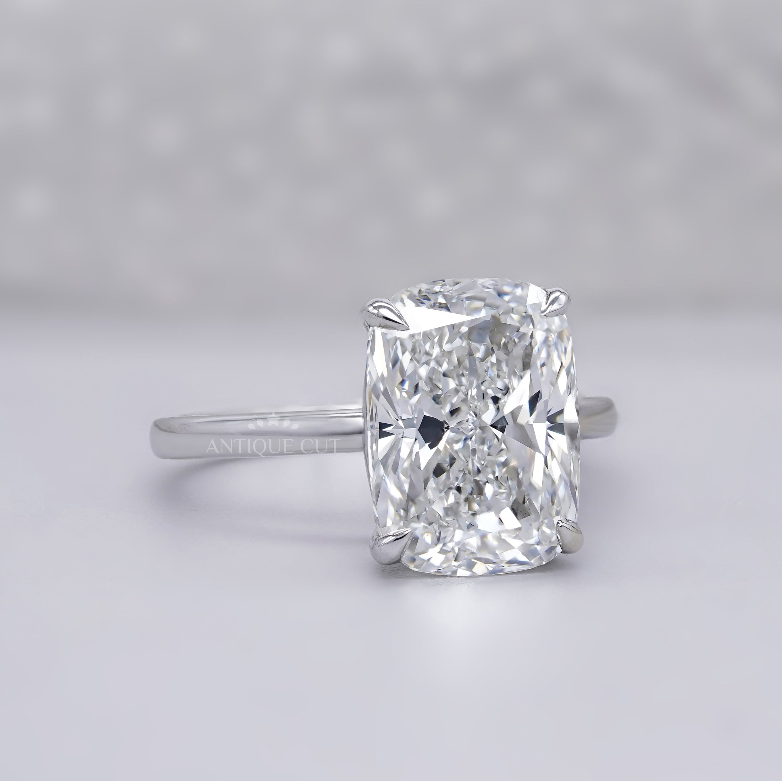 White gold elongated cushion diamond engagement ring
