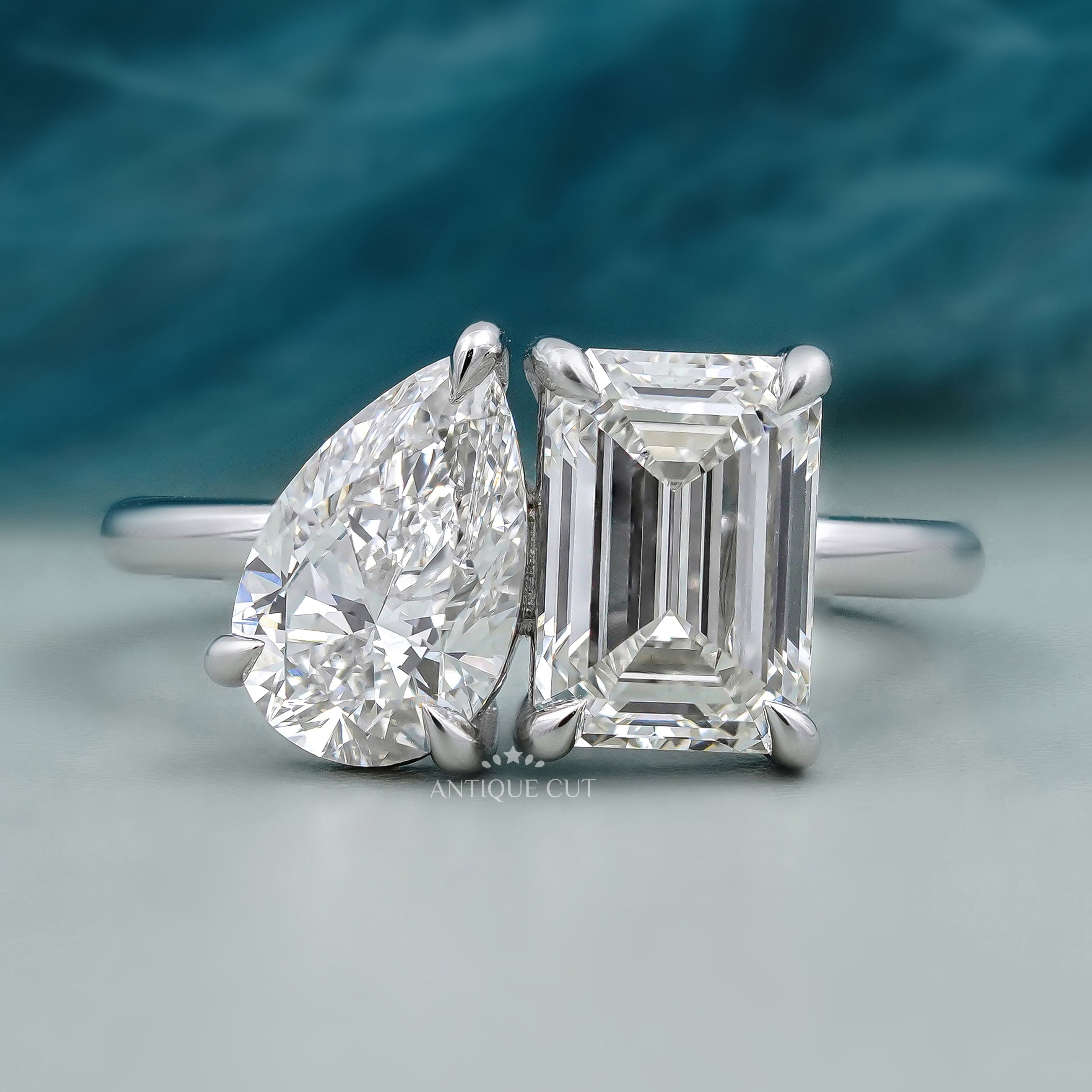 Toi et Moi engagement ring white gold emerald and pear diamond