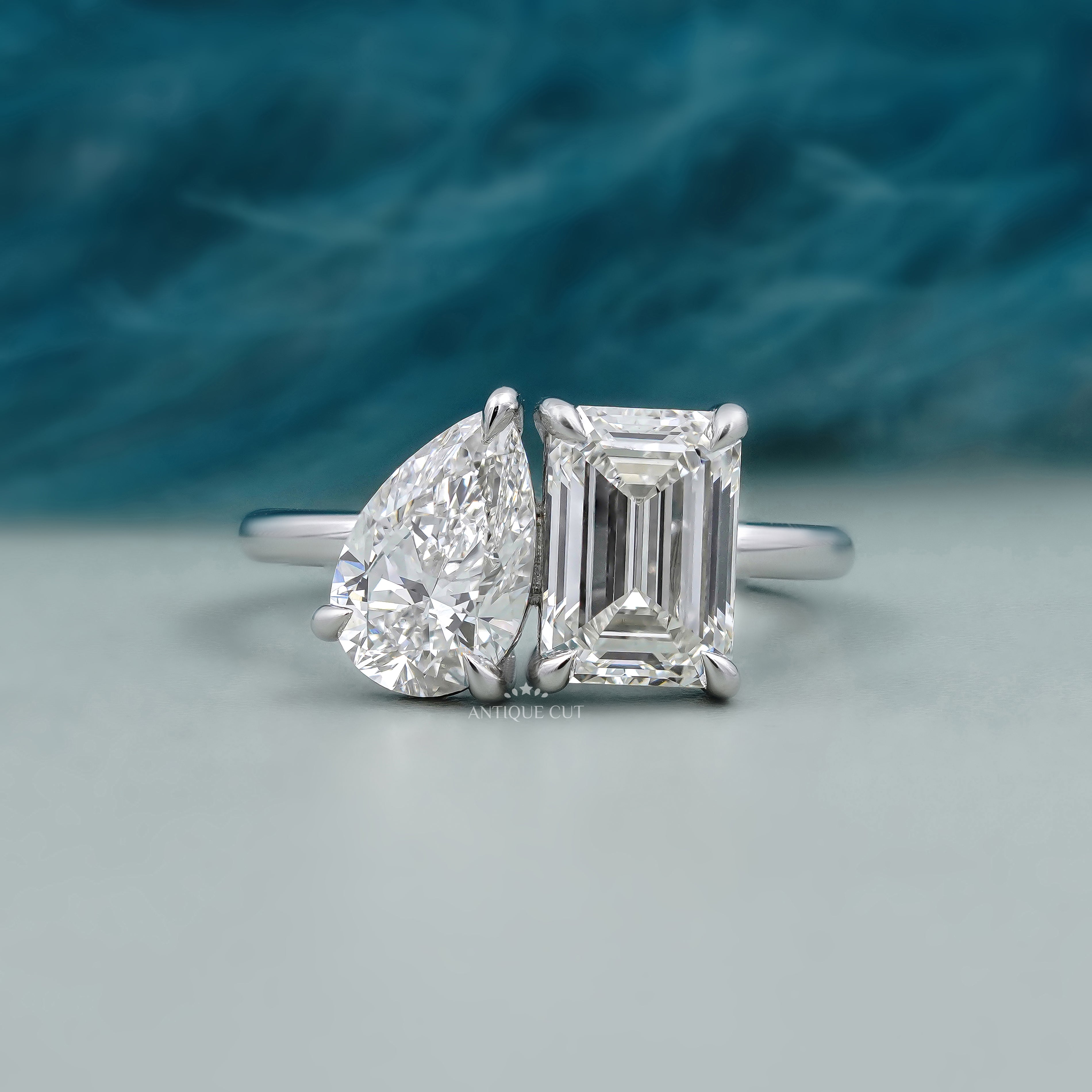 Toi et Moi engagement ring white gold emerald and pear diamond