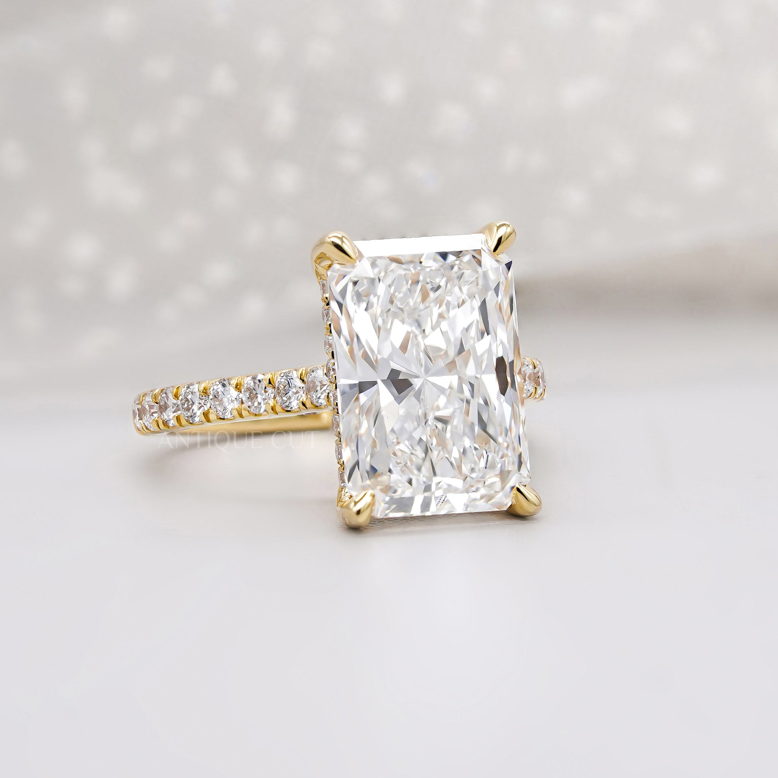 Yellow gold radiant diamond ring with hidden halo