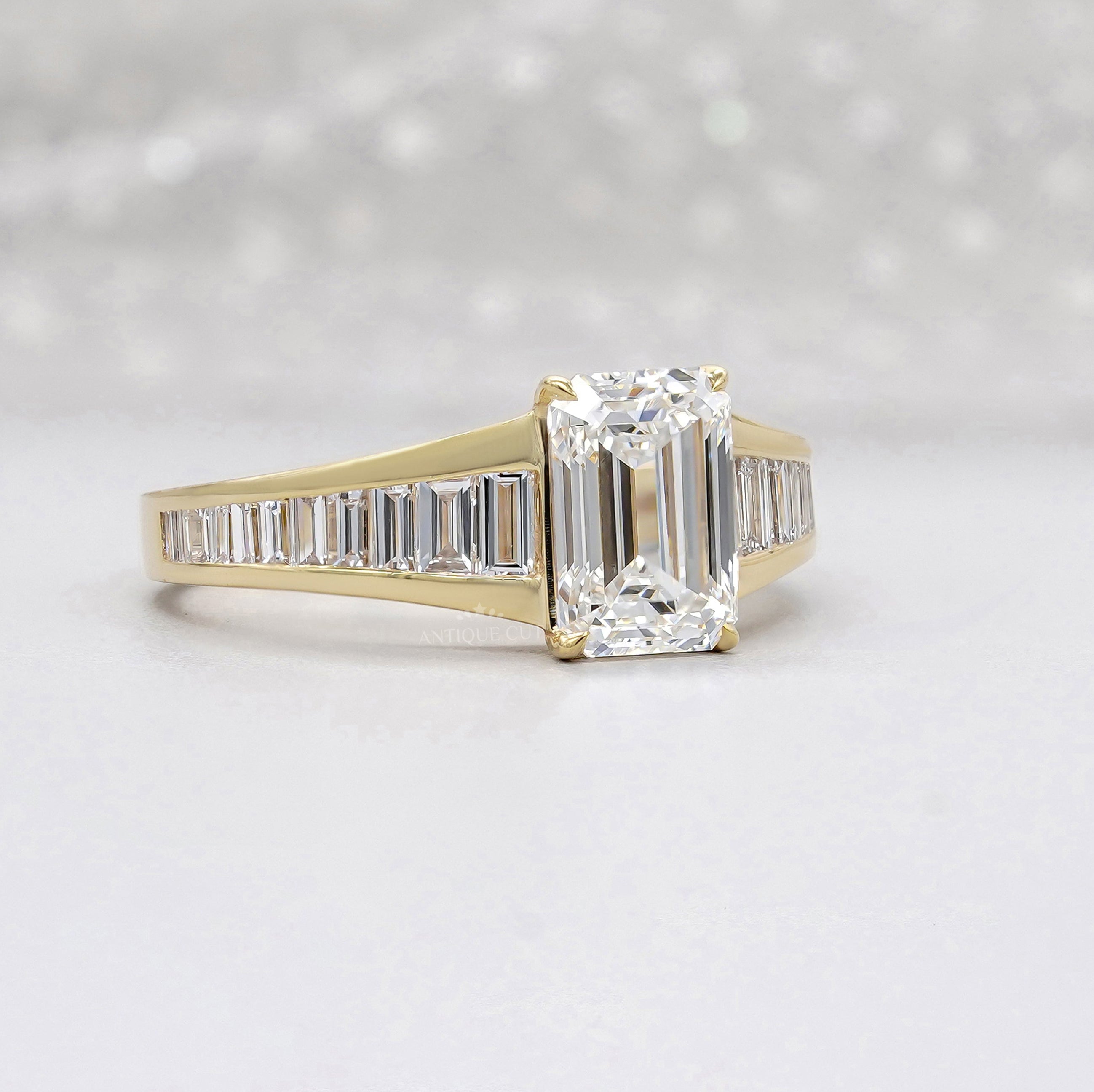 Emerald cut diamond engagement ring with side stones