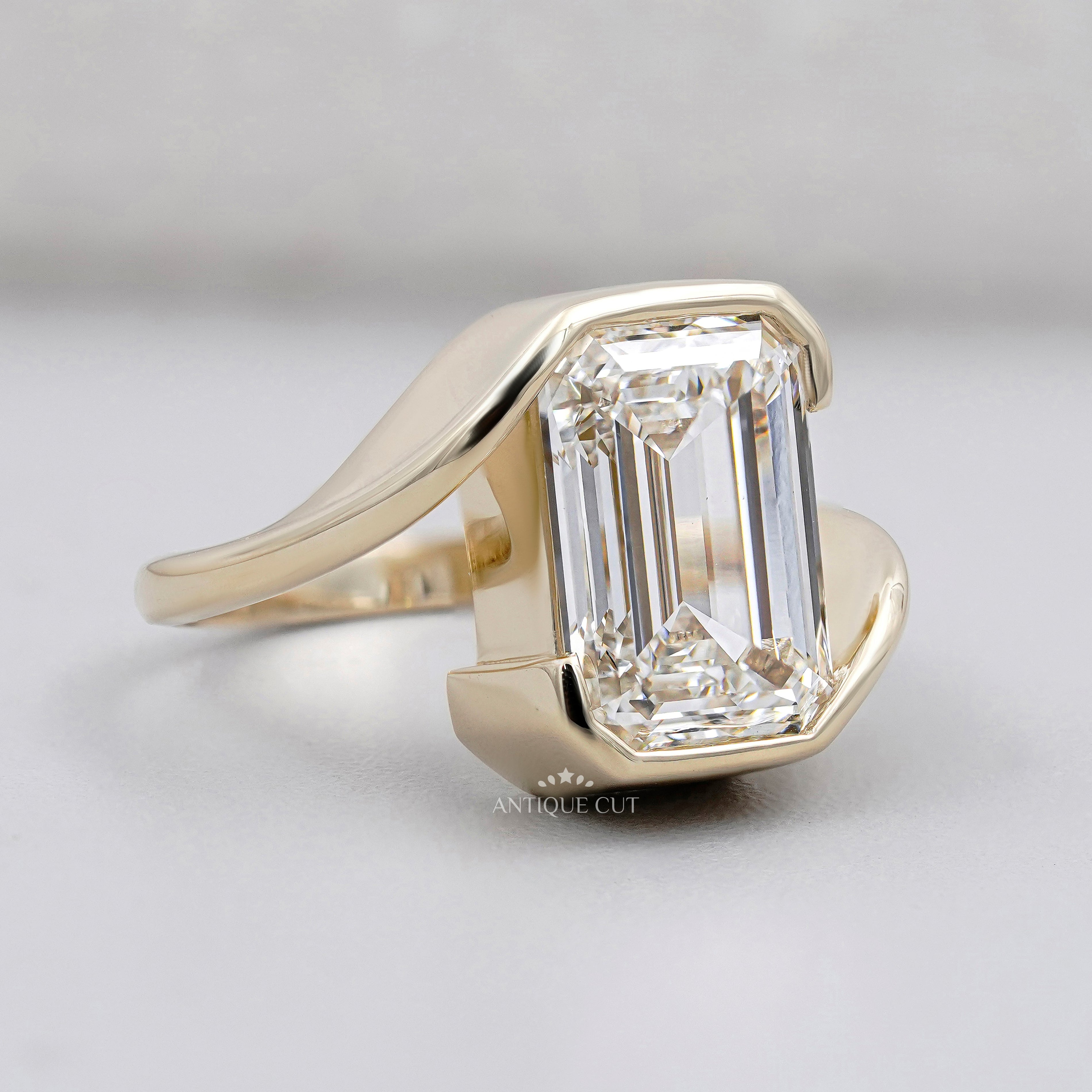 Emerald Cut Engagement Ring with Half Bezel Set