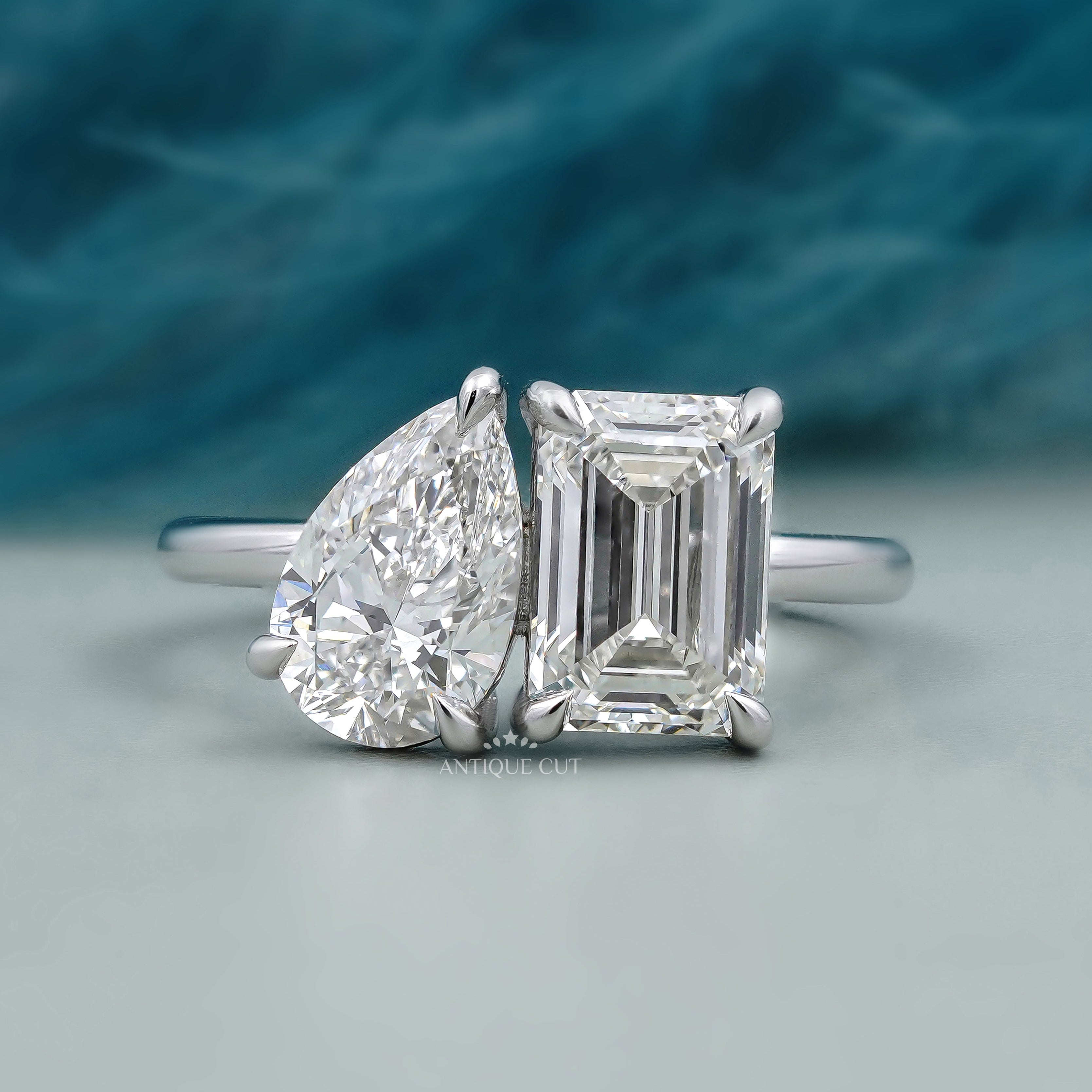 Toi et Moi engagement ring with emerald and pear diamond in white gold