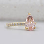 Lab grown pink pear diamond engagement ring with pavé band