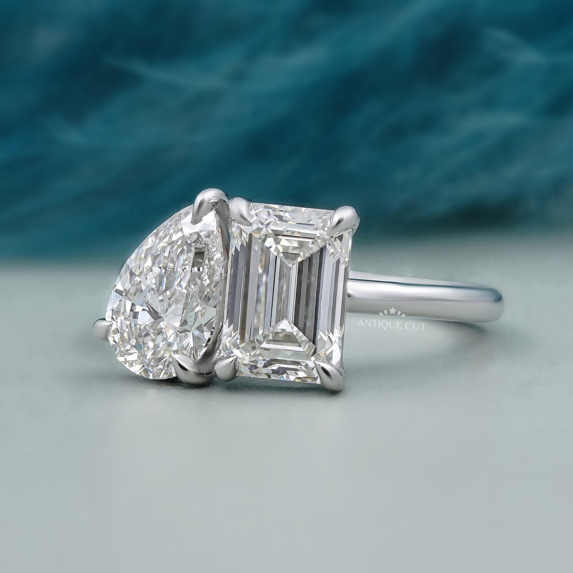 Toi et Moi Engagement Ring with Emerald and Pear Diamond