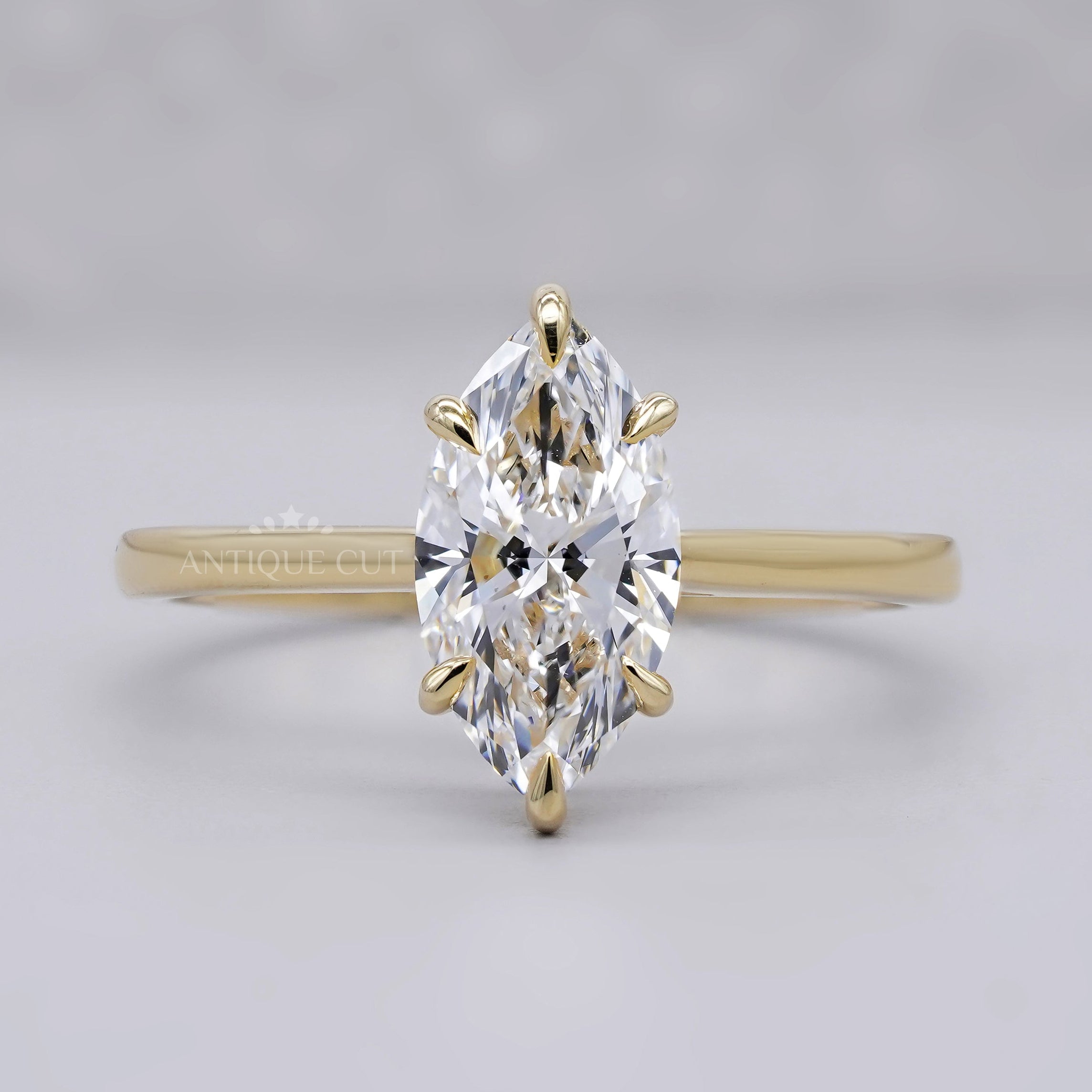 Marquise engagement ring in yellow gold