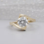 Round cut lab grown diamond engagement ring in yellow gold bypass setting