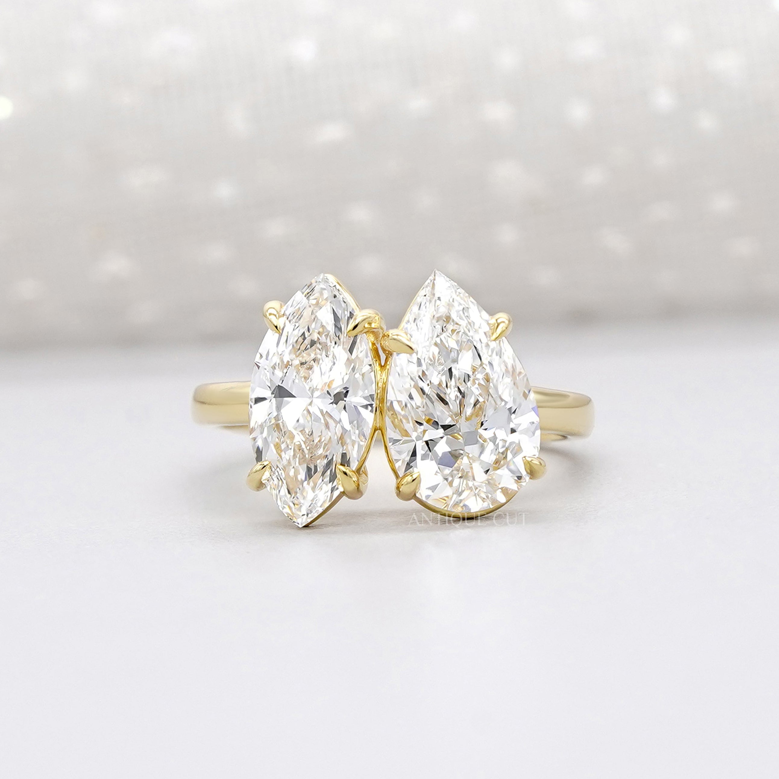 Gold Toi et Moi engagement ring with marquise and pear diamond
