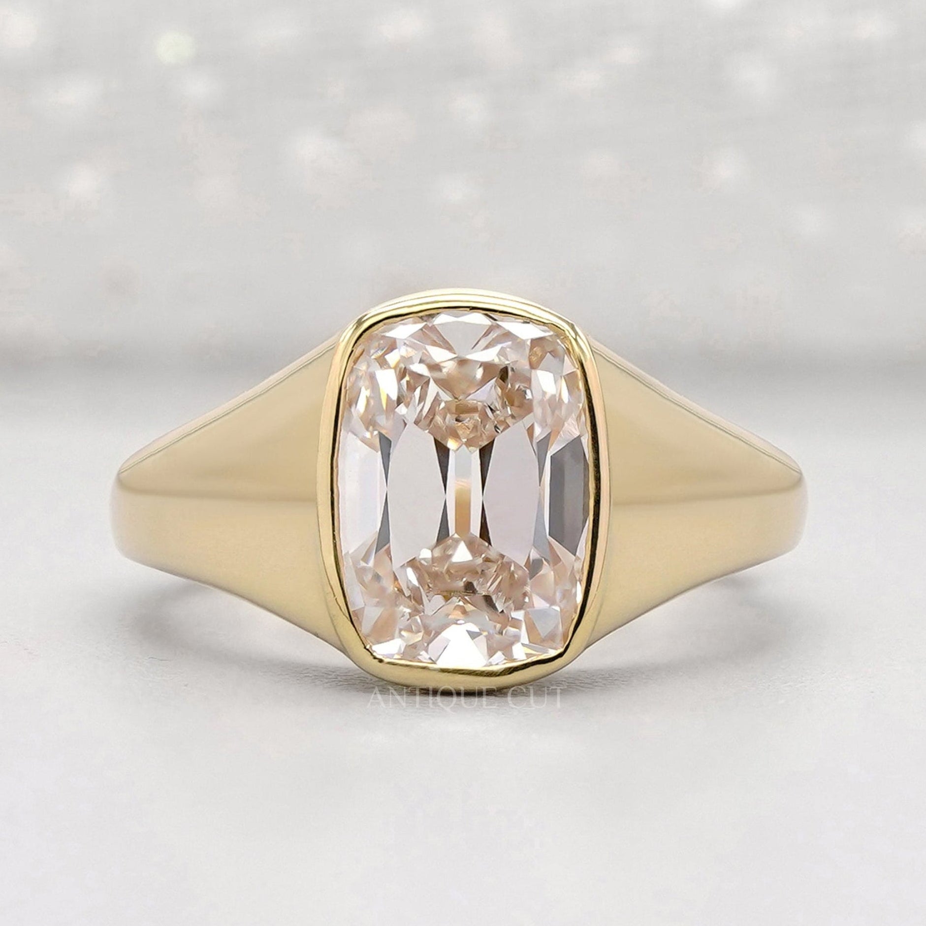 Old mine cushion cut engagement ring in yellow gold