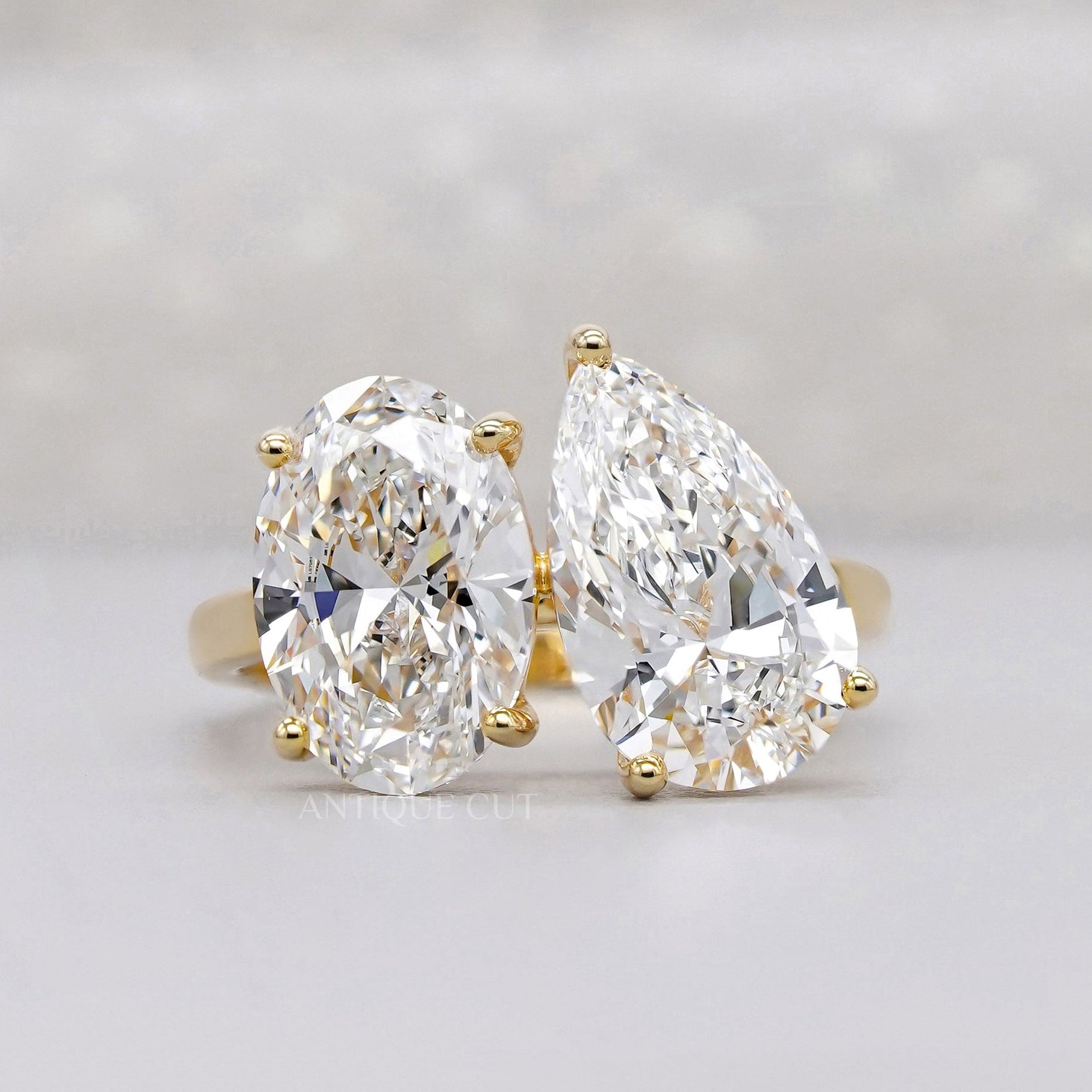 Oval and pear Toi Et Moi lab grown diamond ring in yellow gold