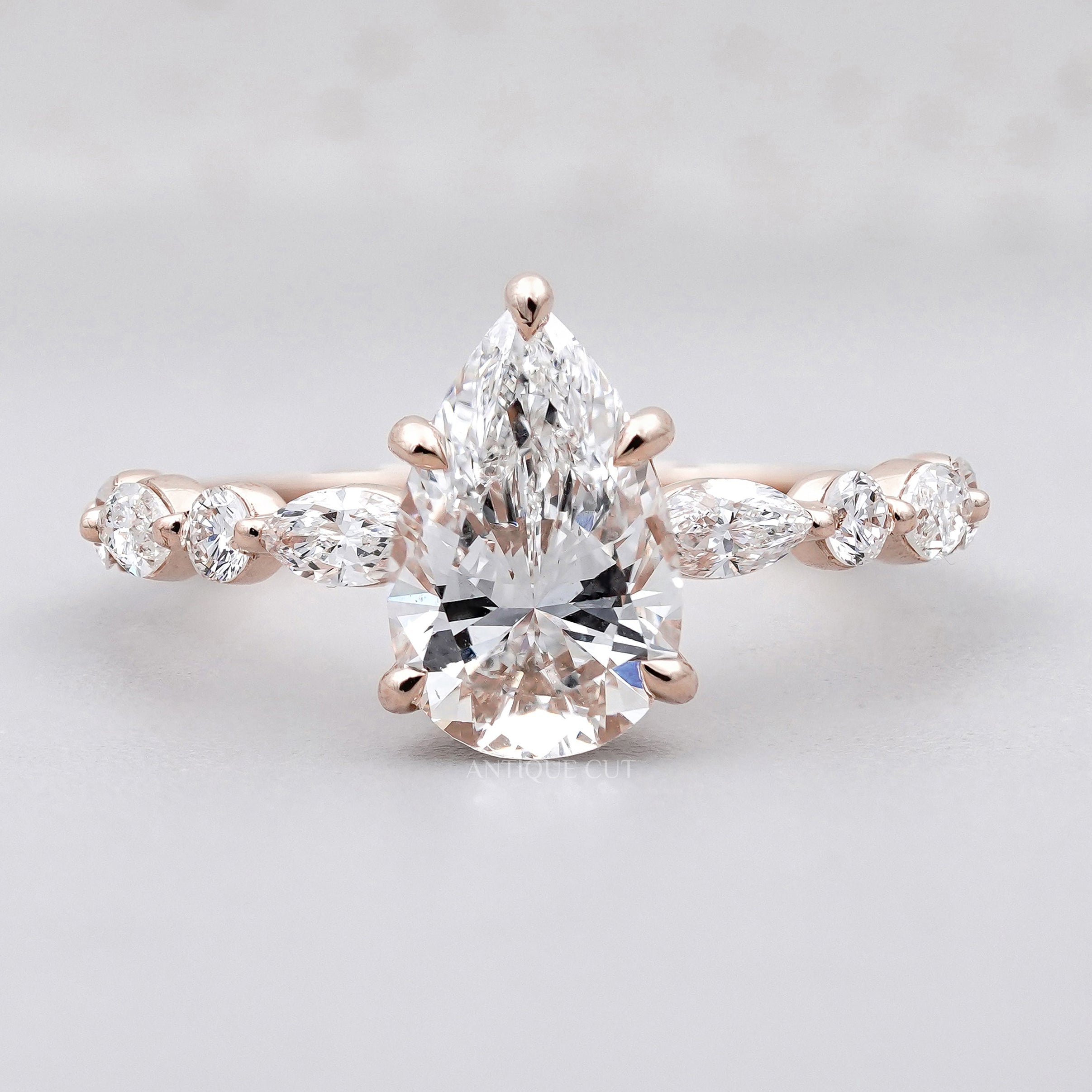Vintage pear cut engagement ring in rose gold
