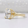 Yellow gold engagement ring with radiant cut center diamond