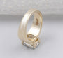 Yellow gold engagement ring featuring an elongated radiant cut center diamond