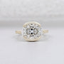 east west oval engagement ring bezel set yellow gold