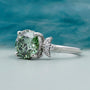 Round cut green lab grown diamond ring with side stones