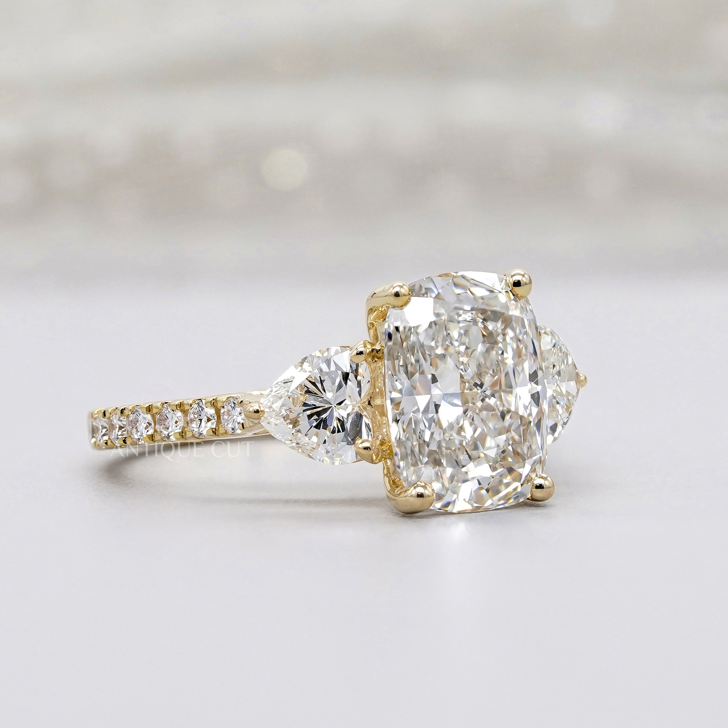 IGI certified three stone cushion diamond ring