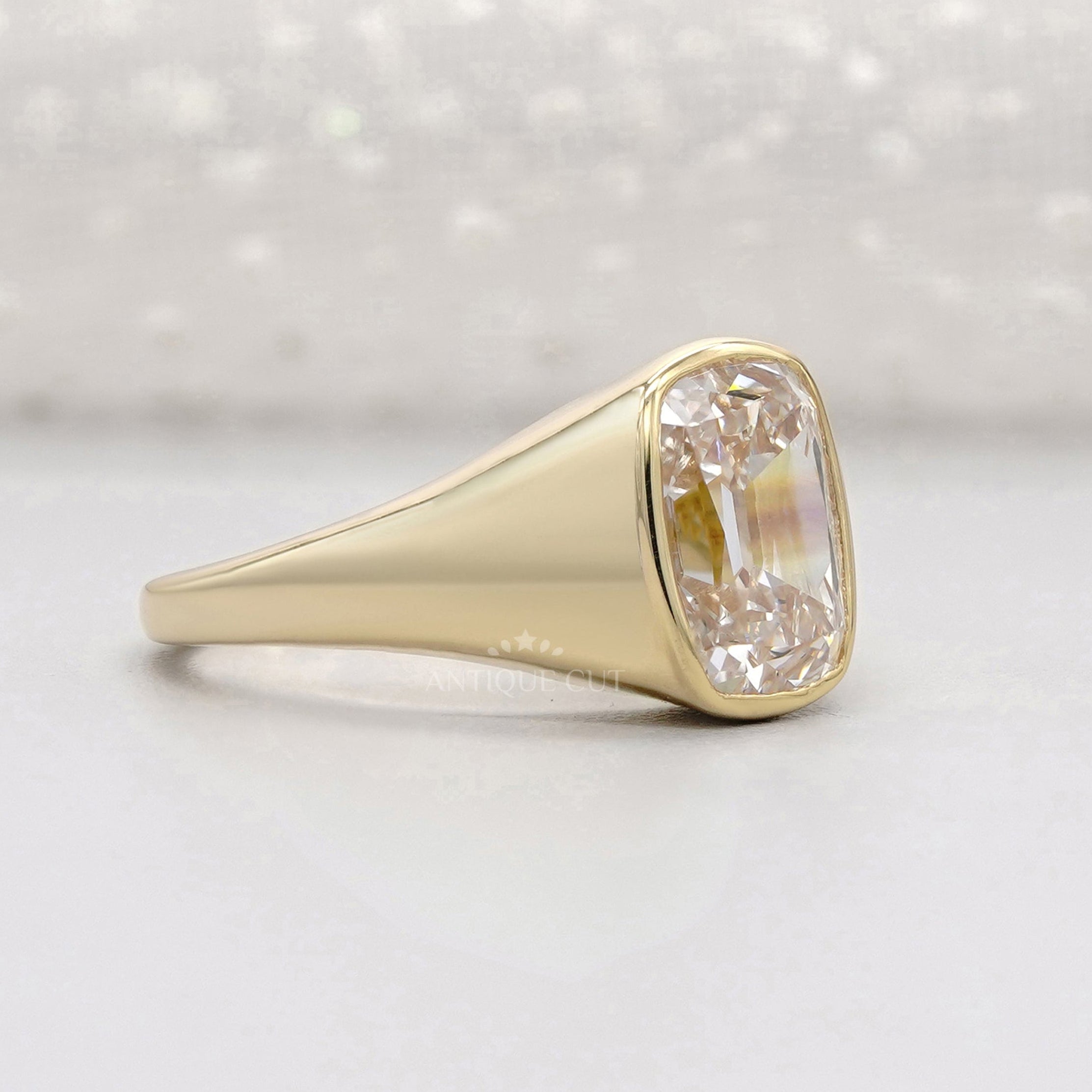 Old mine cushion cut engagement ring in yellow gold
