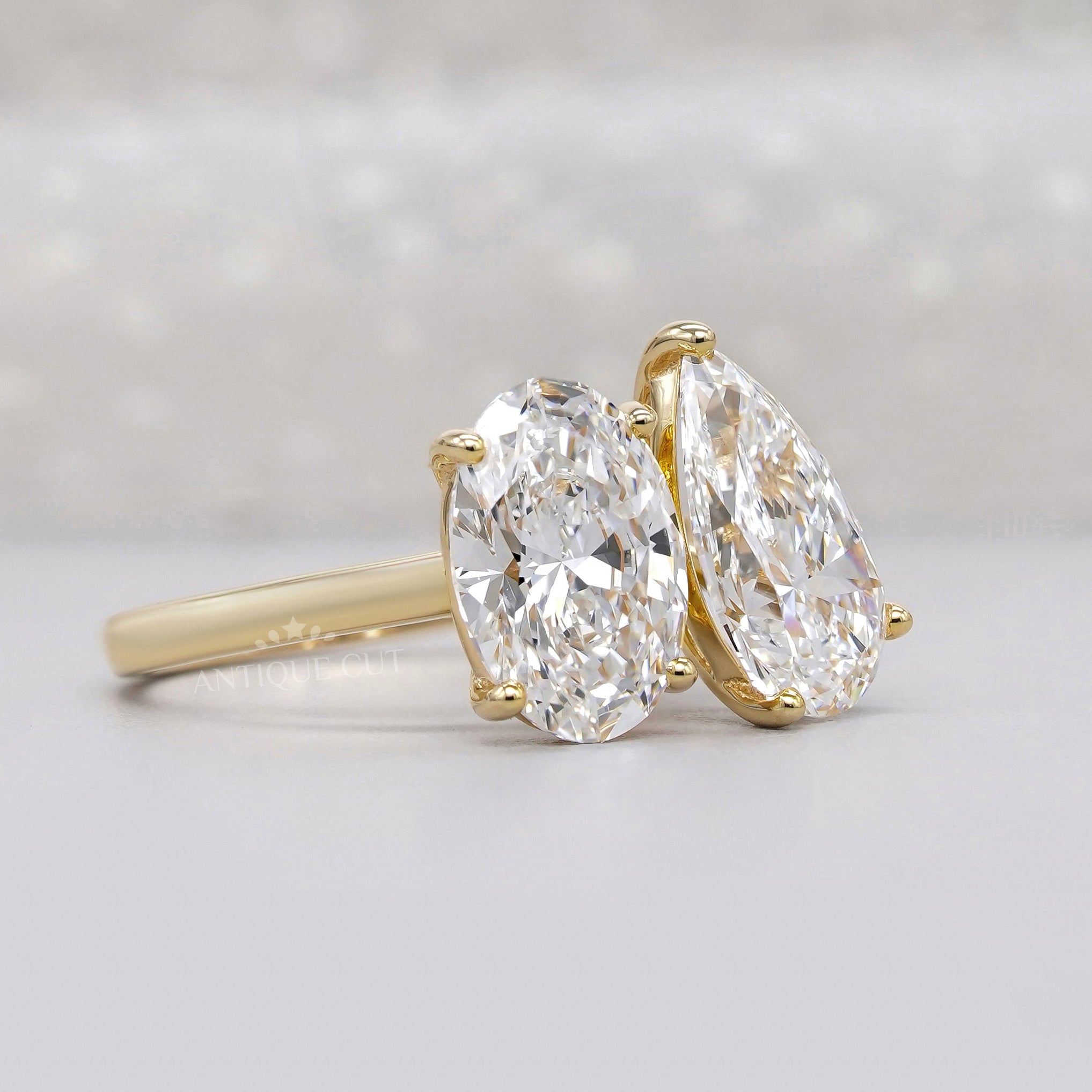Yellow gold oval and pear lab grown diamond ring